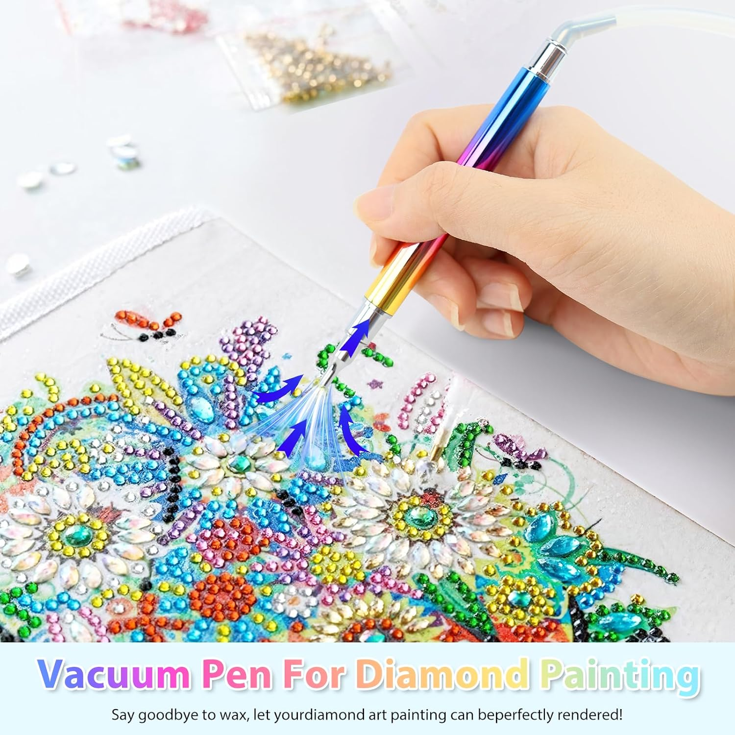 Hand hält einen bunten Vakuumstift für Diamantmalerei, um bunte Perlen zu platzieren.