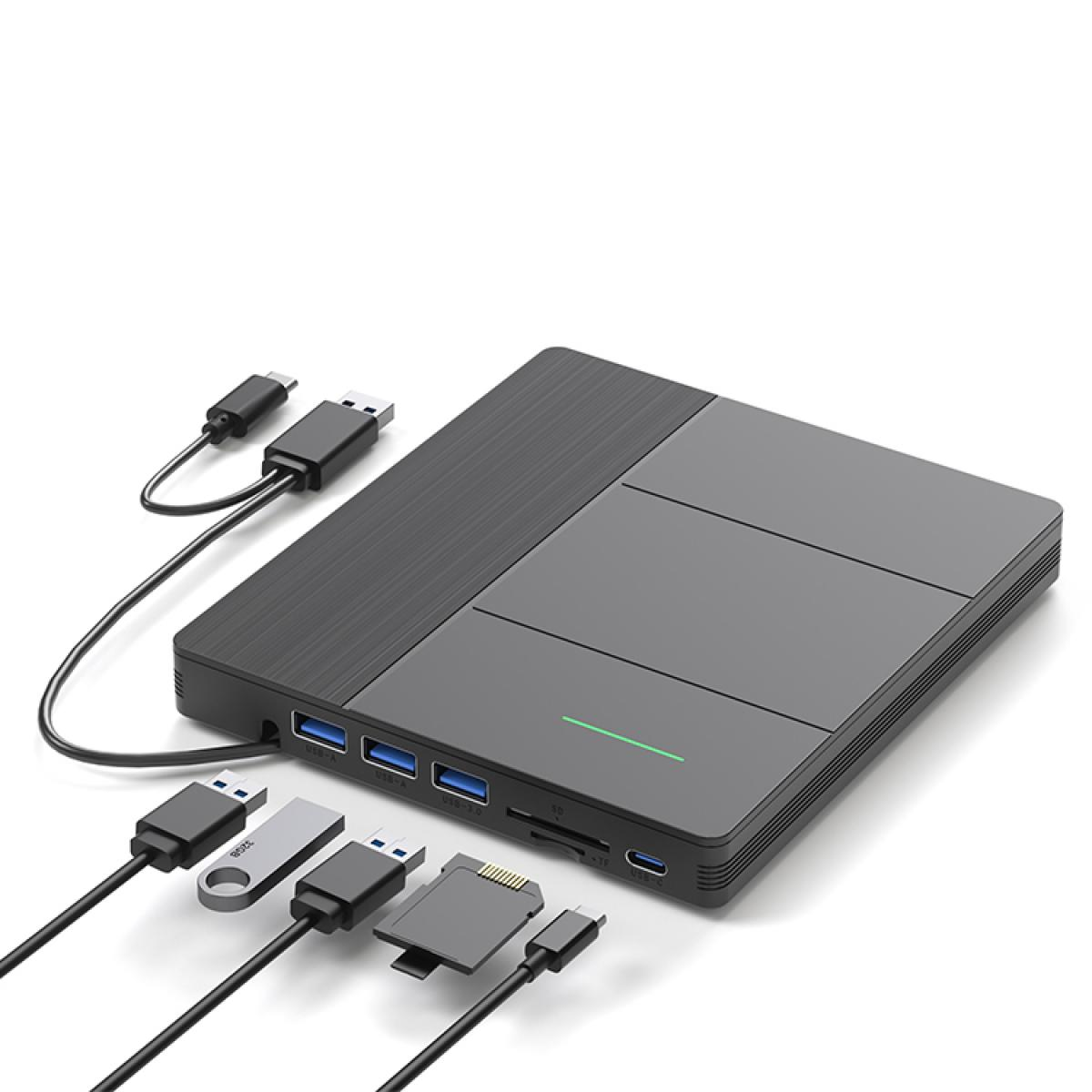 Eine schwarze USB-Hub mit mehreren Anschlüssen und angeschlossenen Geräten wie USB-Sticks und Kabeln.