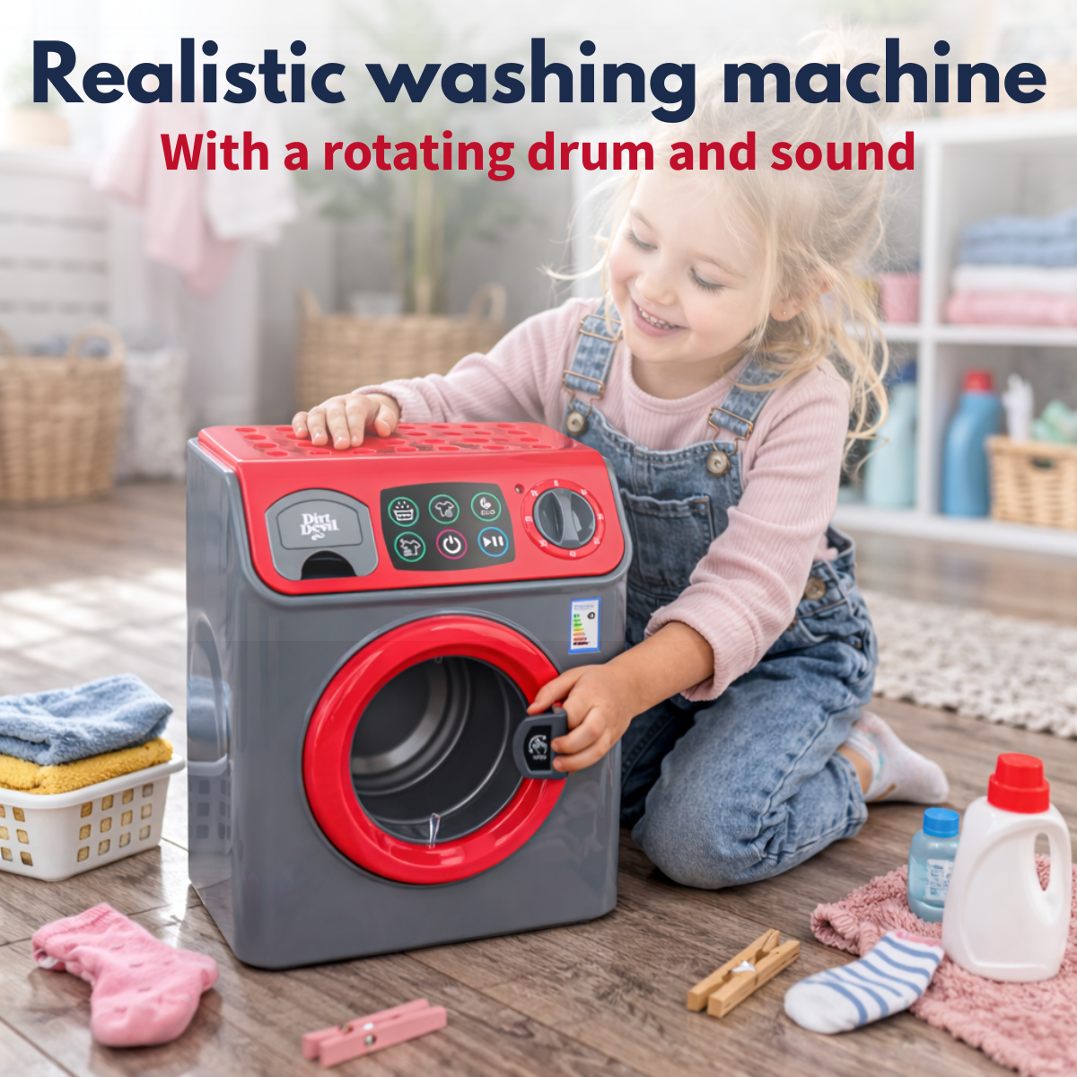 A young girl plays with a toy washing machine in a bright room.