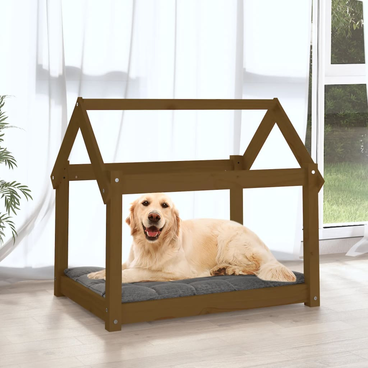Ein Golden Retriever liegt in einem braunen Hundebett mit Dach.