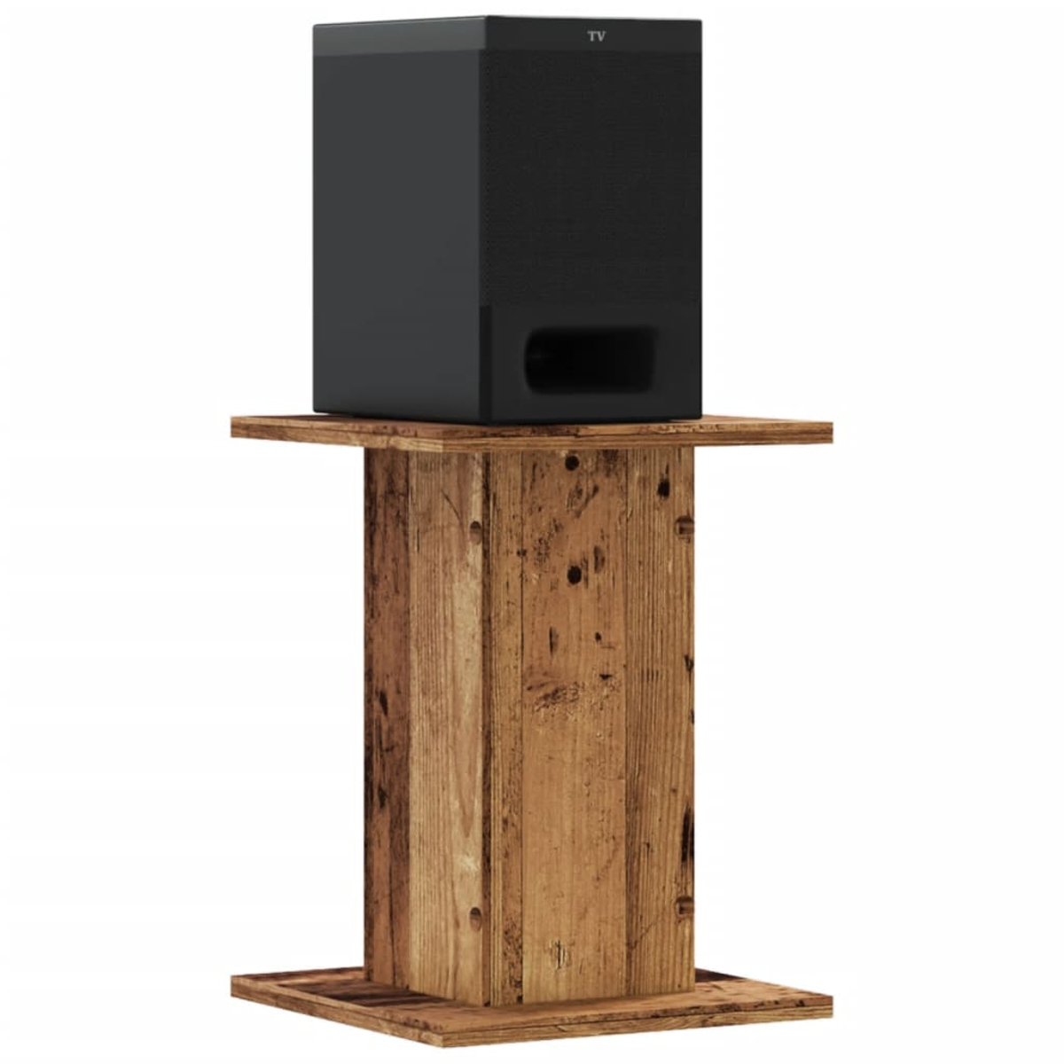 Schwarzer Subwoofer auf einem Holztisch mit sichtbarer Bassreflexöffnung.