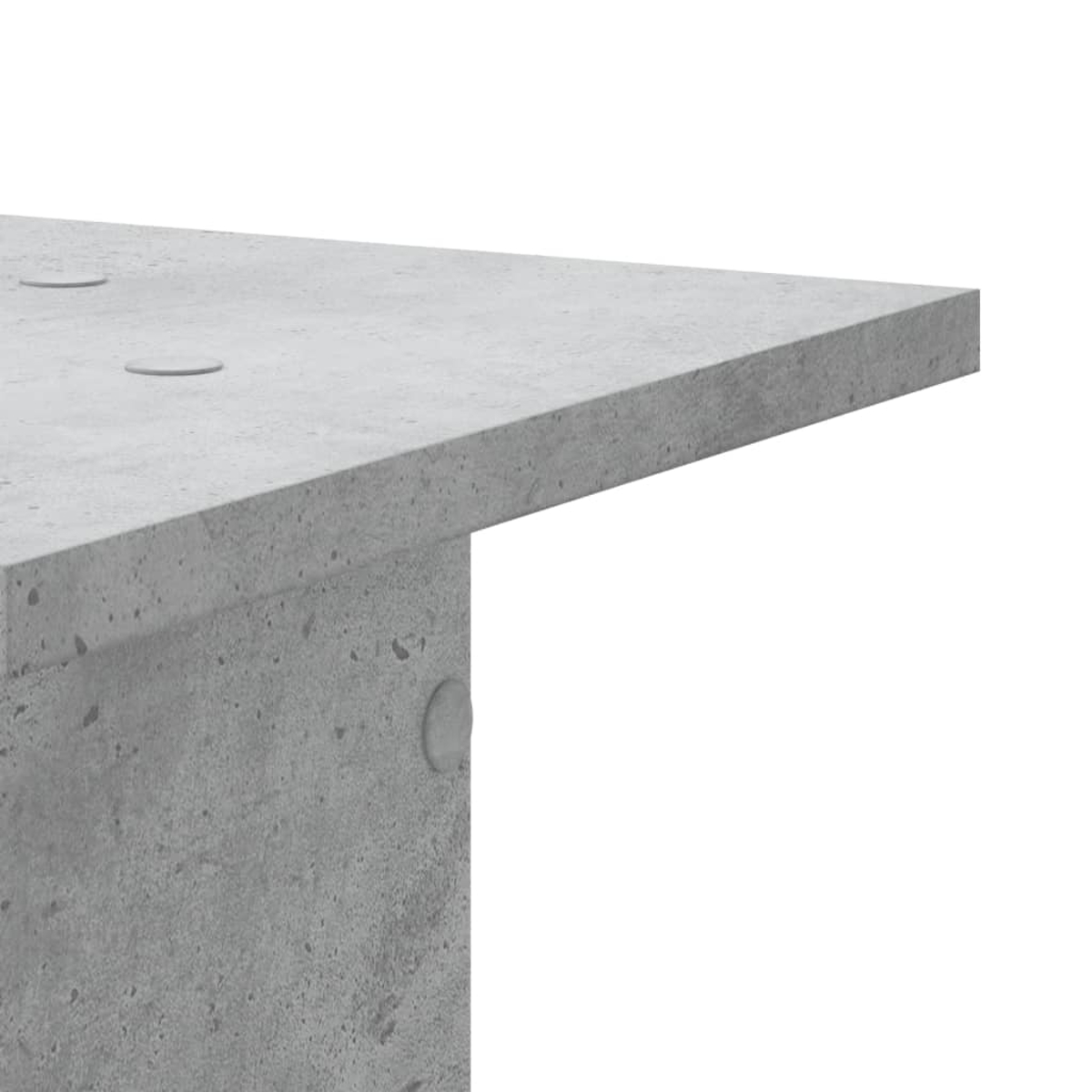 Grauer Beton-Tisch mit abgerundeten Kanten und sichtbaren Poren.