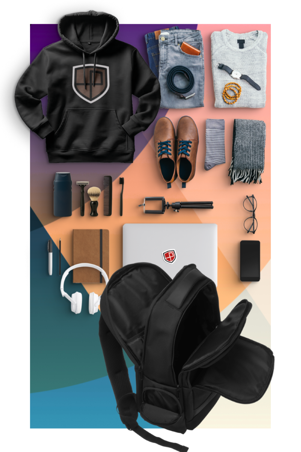 Czarna bluza z kapturem, dżinsy, buty, laptop, plecak, słuchawki, okulary, telefon.