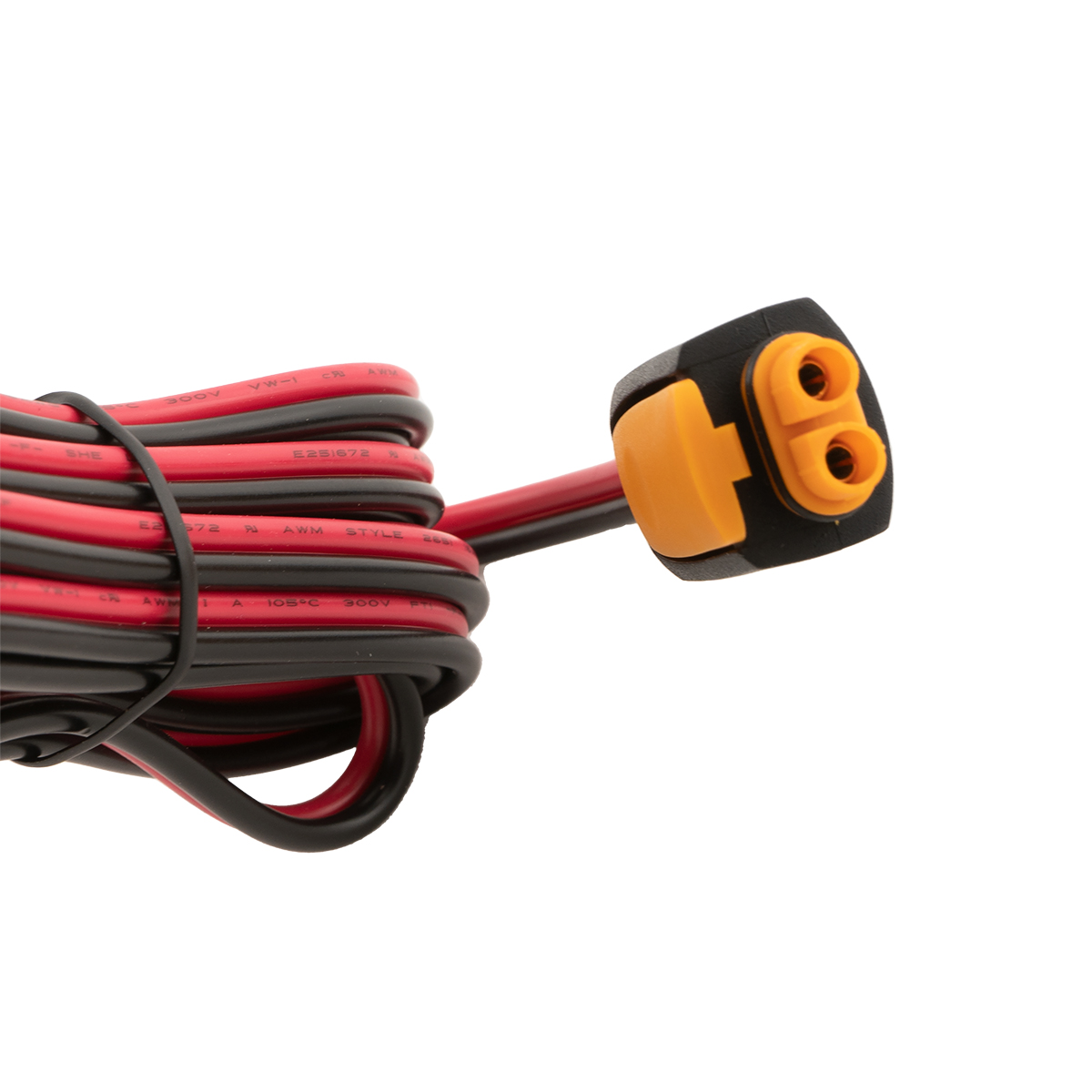 Rot-schwarze Kabel aufgewickelt, mit einem schwarz-orangen Zweipolstecker.
