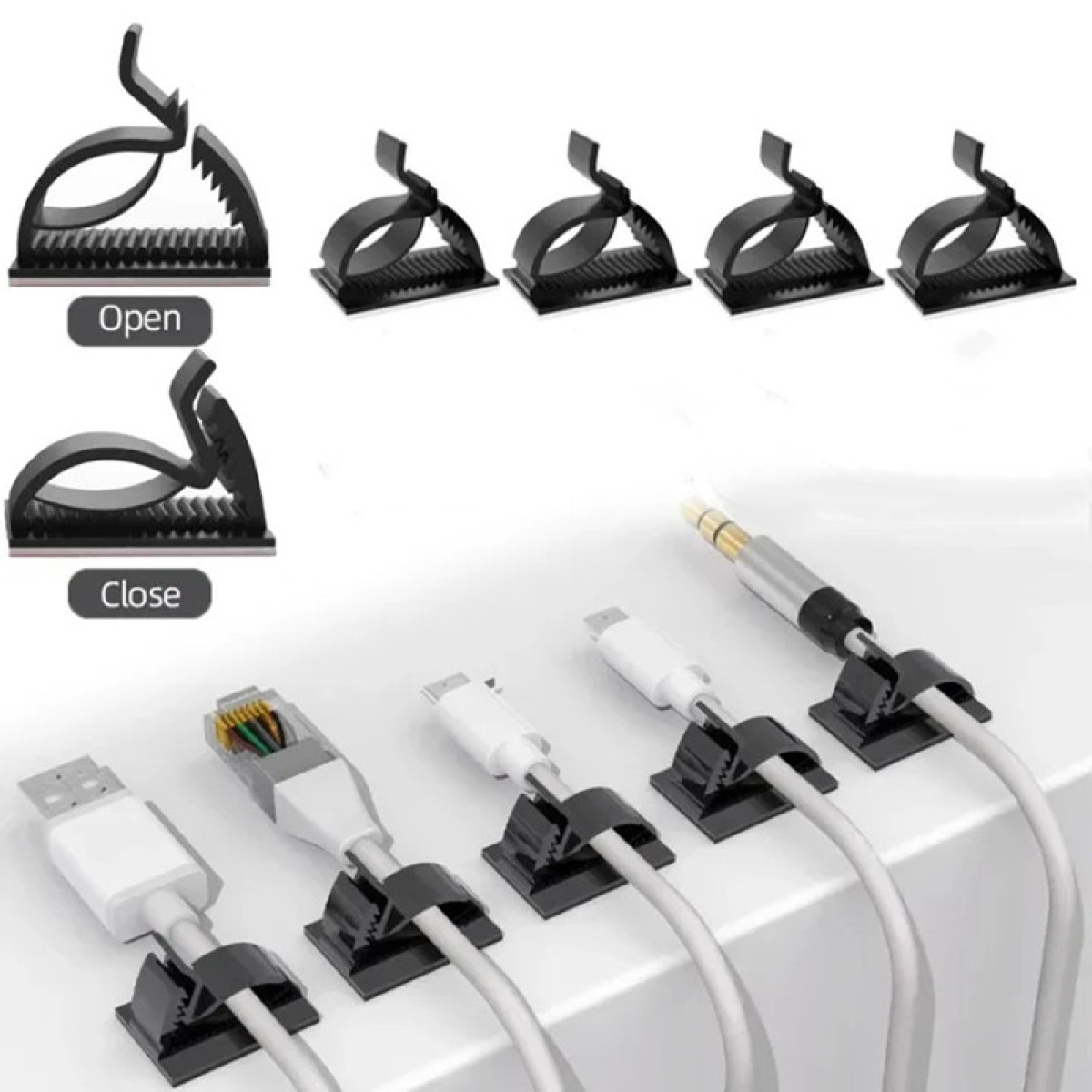 Schwarze Kabelclips halten verschiedene Kabel, darunter USB und Ethernet, ordentlich.