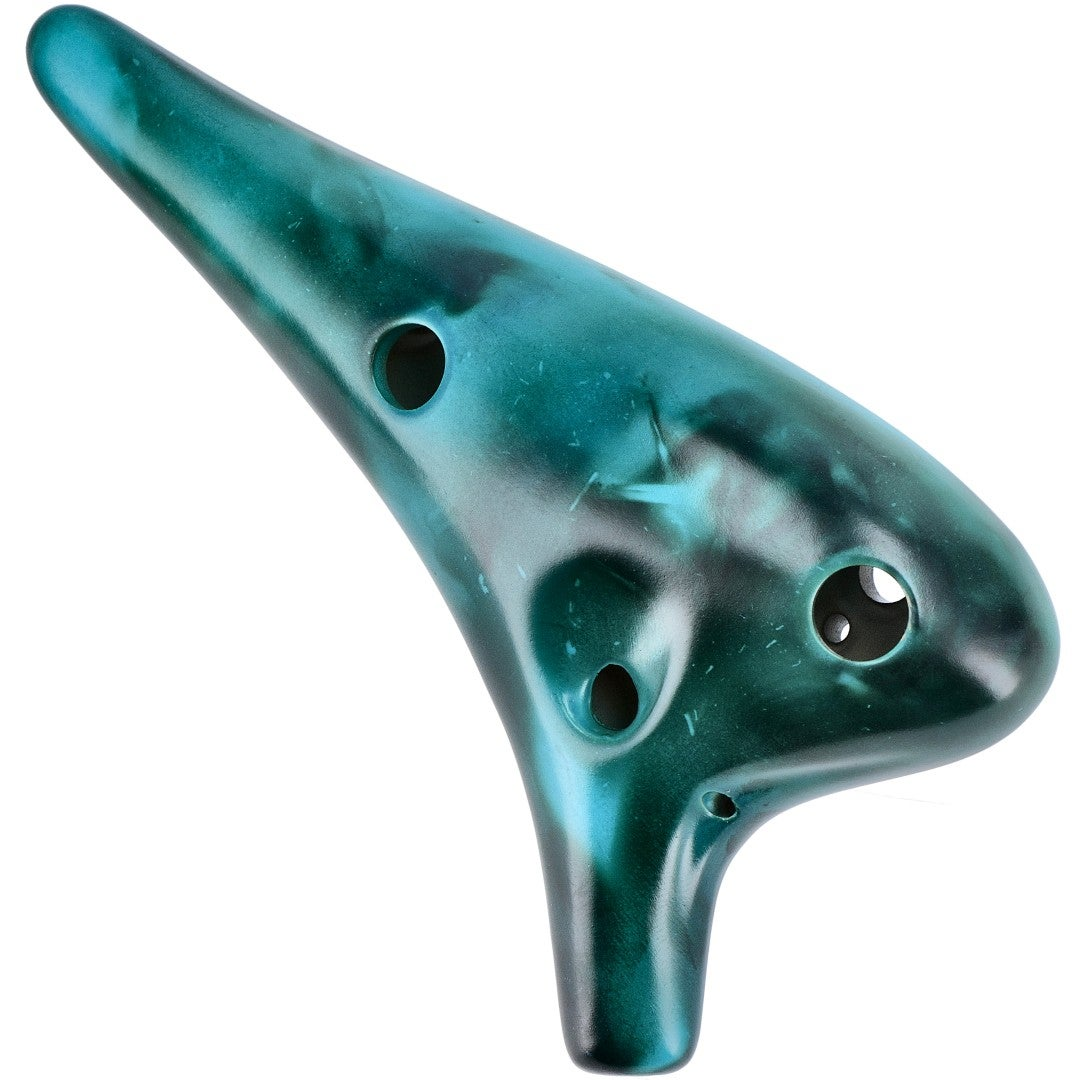An emerald green ocarina with blue tones, isolated on a white background.