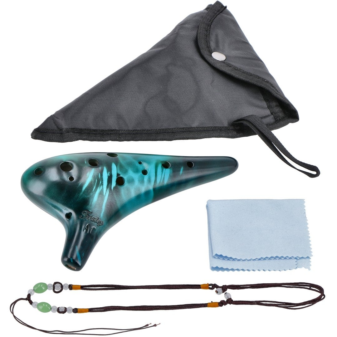 Teal ocarina with black bag, blue cloth, and beaded lanyard.