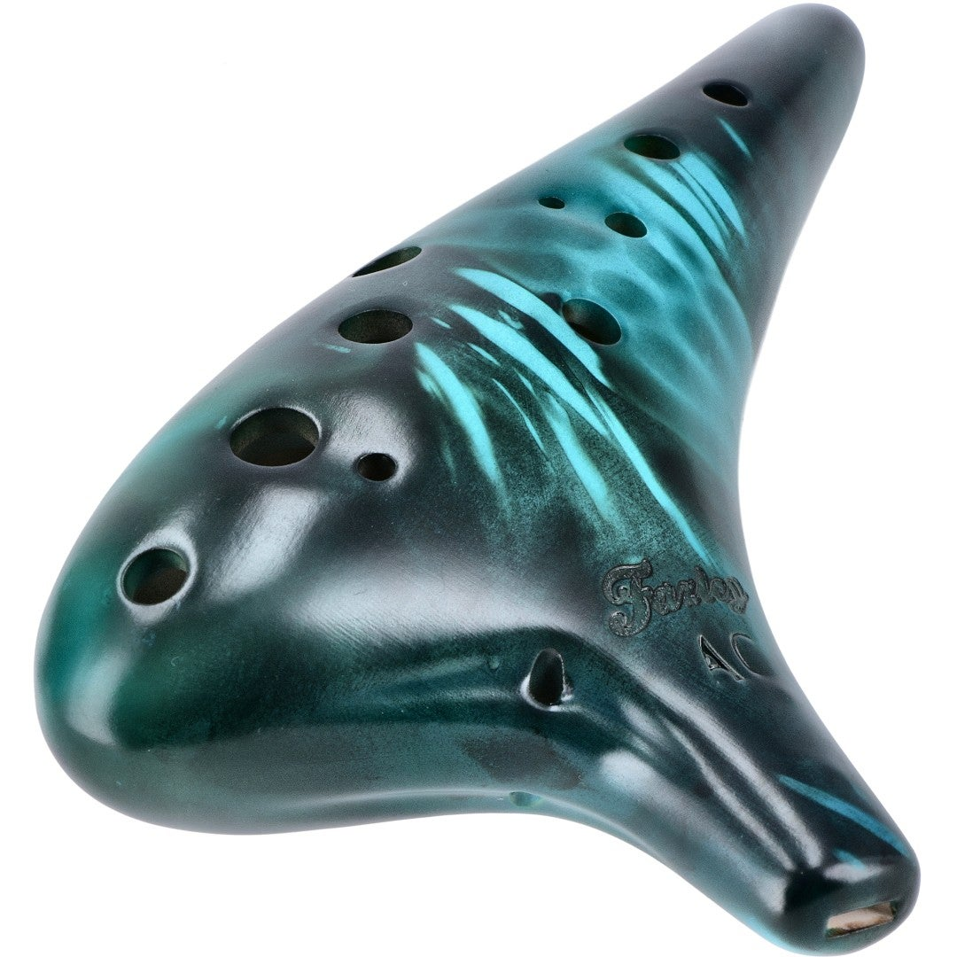 A dark green ocarina with turquoise swirls and holes.