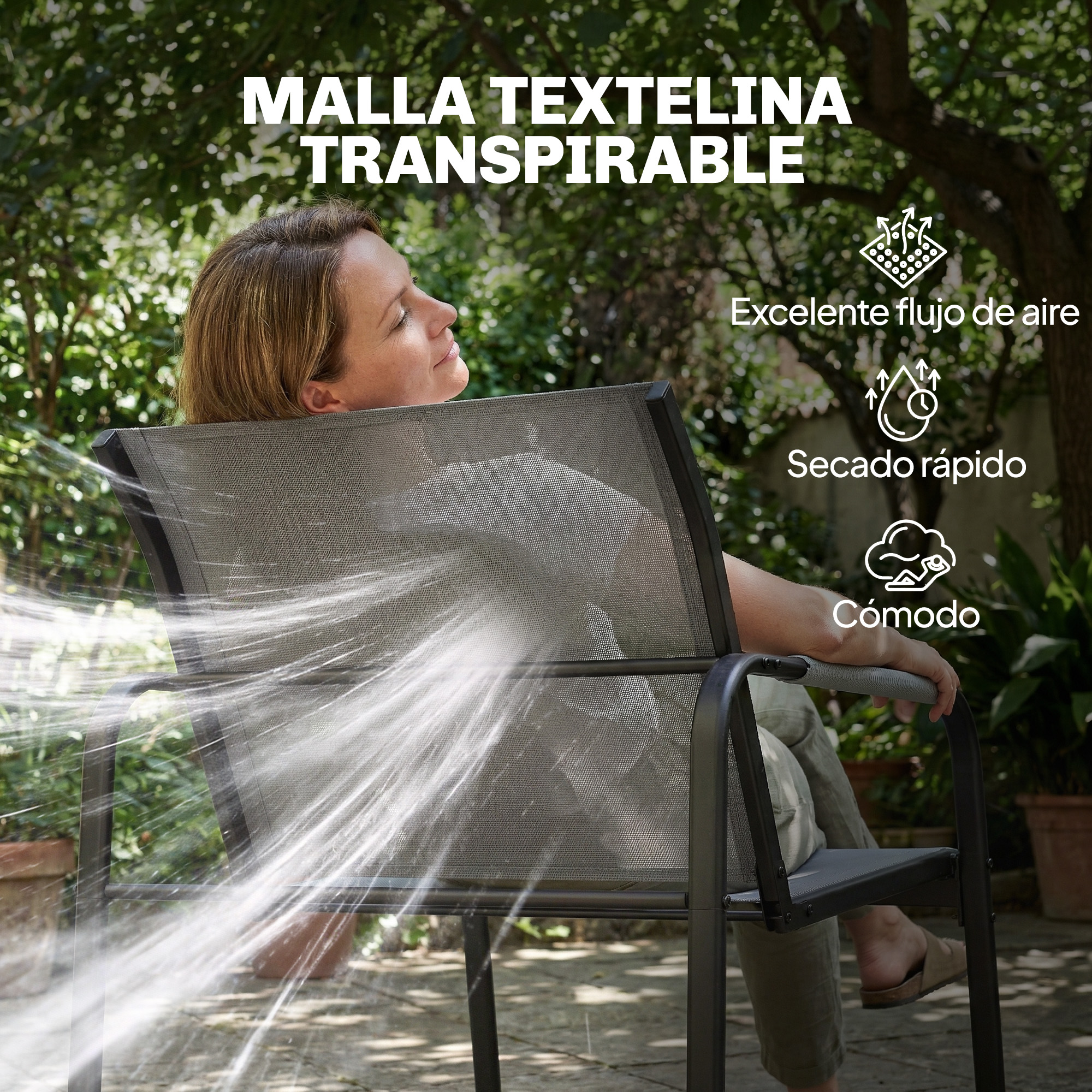 Una mujer se relaja en una silla mientras le salpica agua. Al aire libre en un jardín.