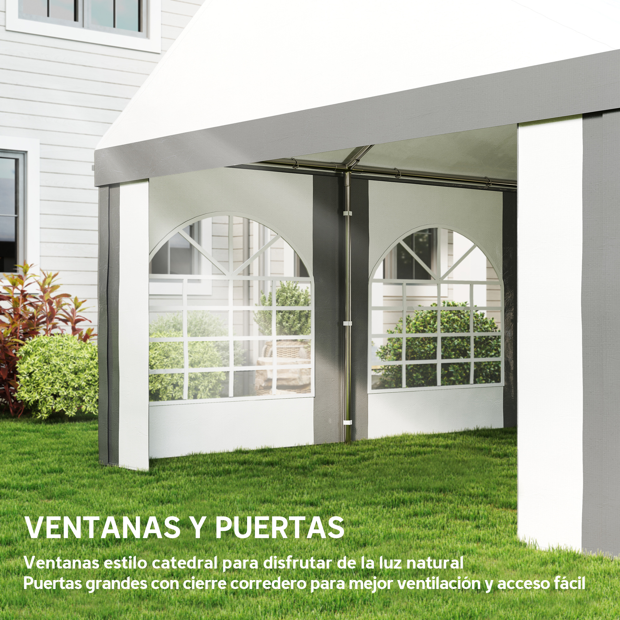 Una carpa blanca con ventanas y puertas grandes, sobre césped verde.