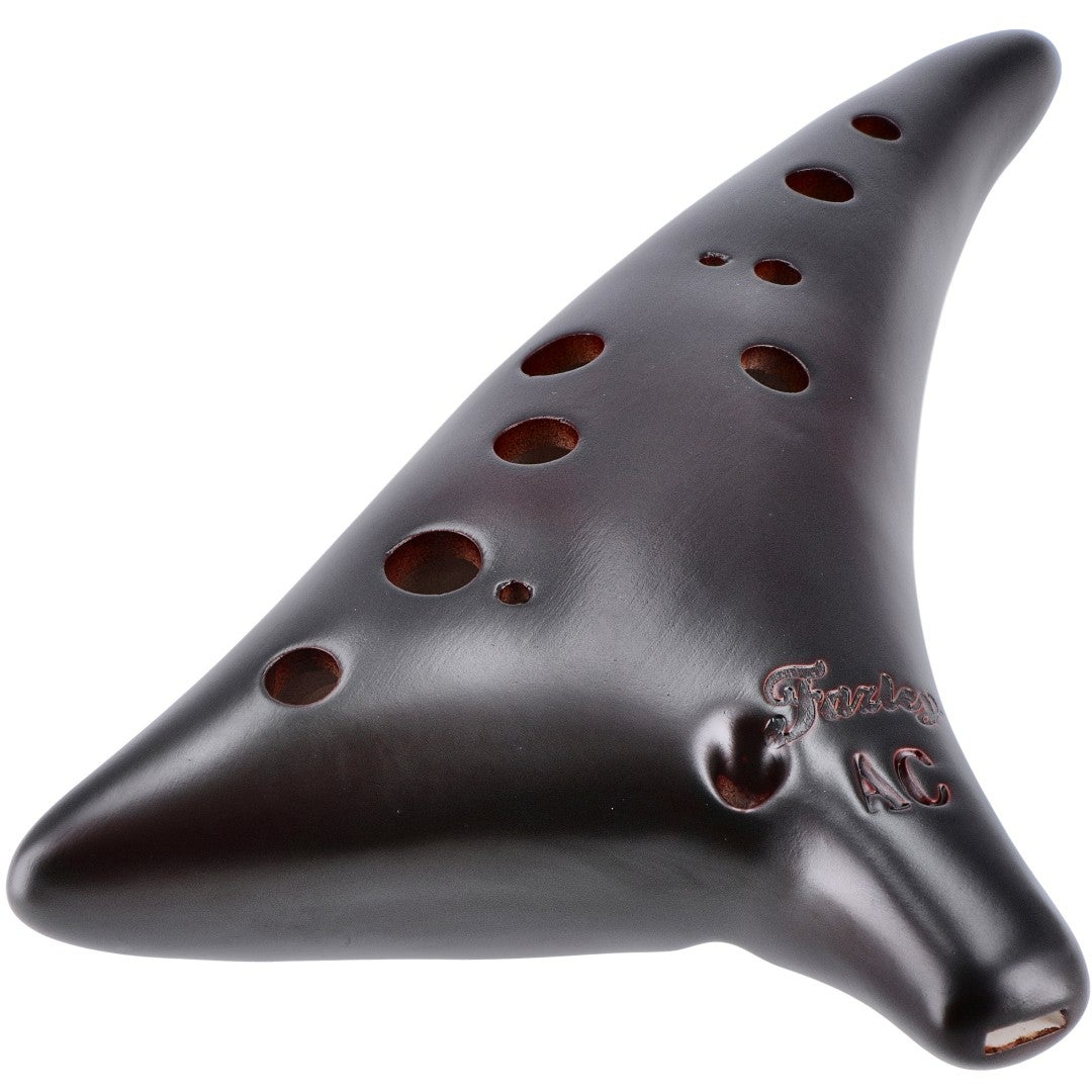 Dark brown ocarina with many holes and engraved text 'Fuytes AC'.