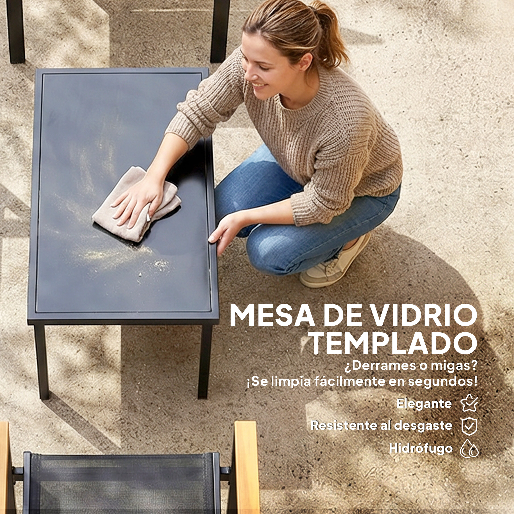Una mujer limpia una mesa de vidrio con un paño.