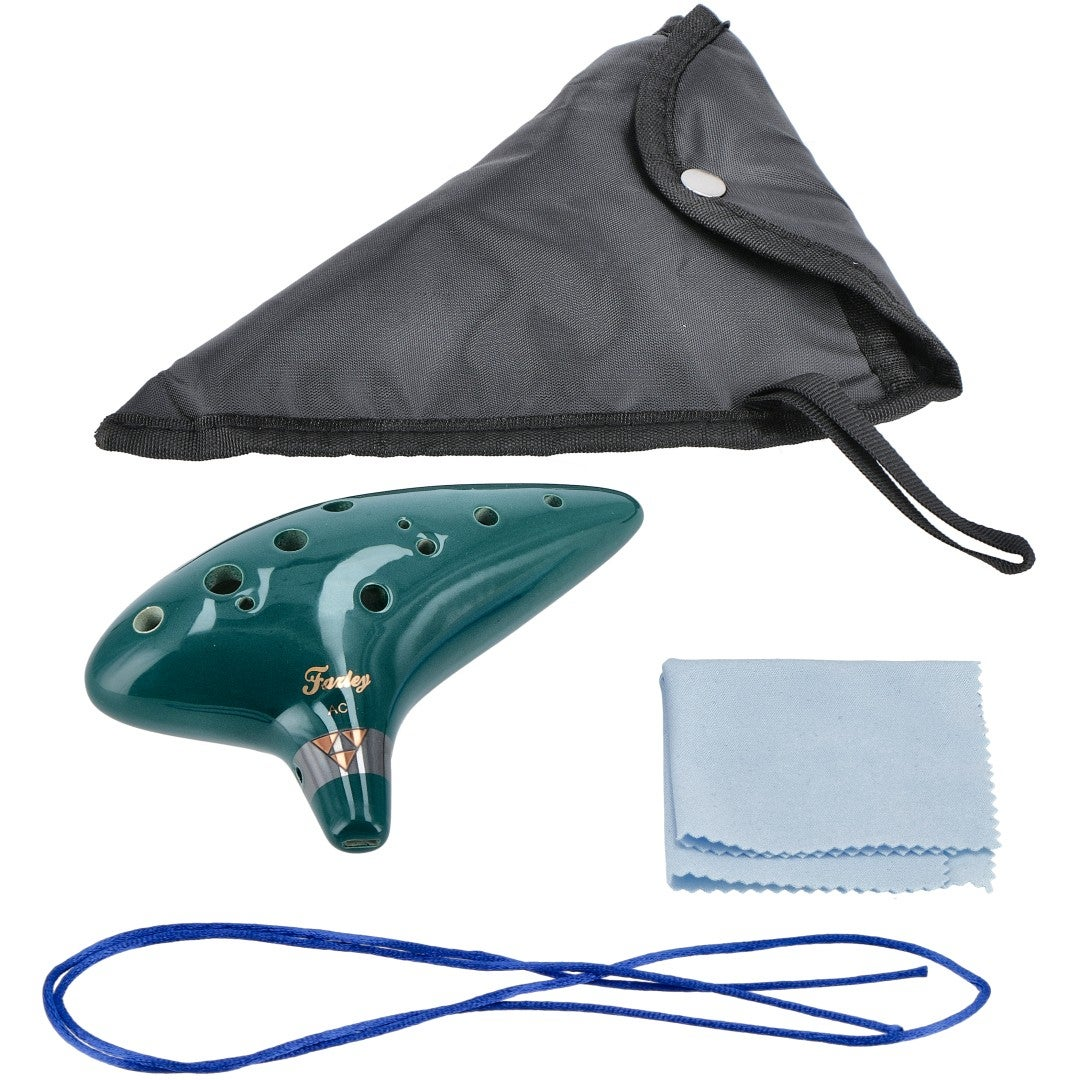 A green ocarina with a black case, blue string, and cleaning cloth.
