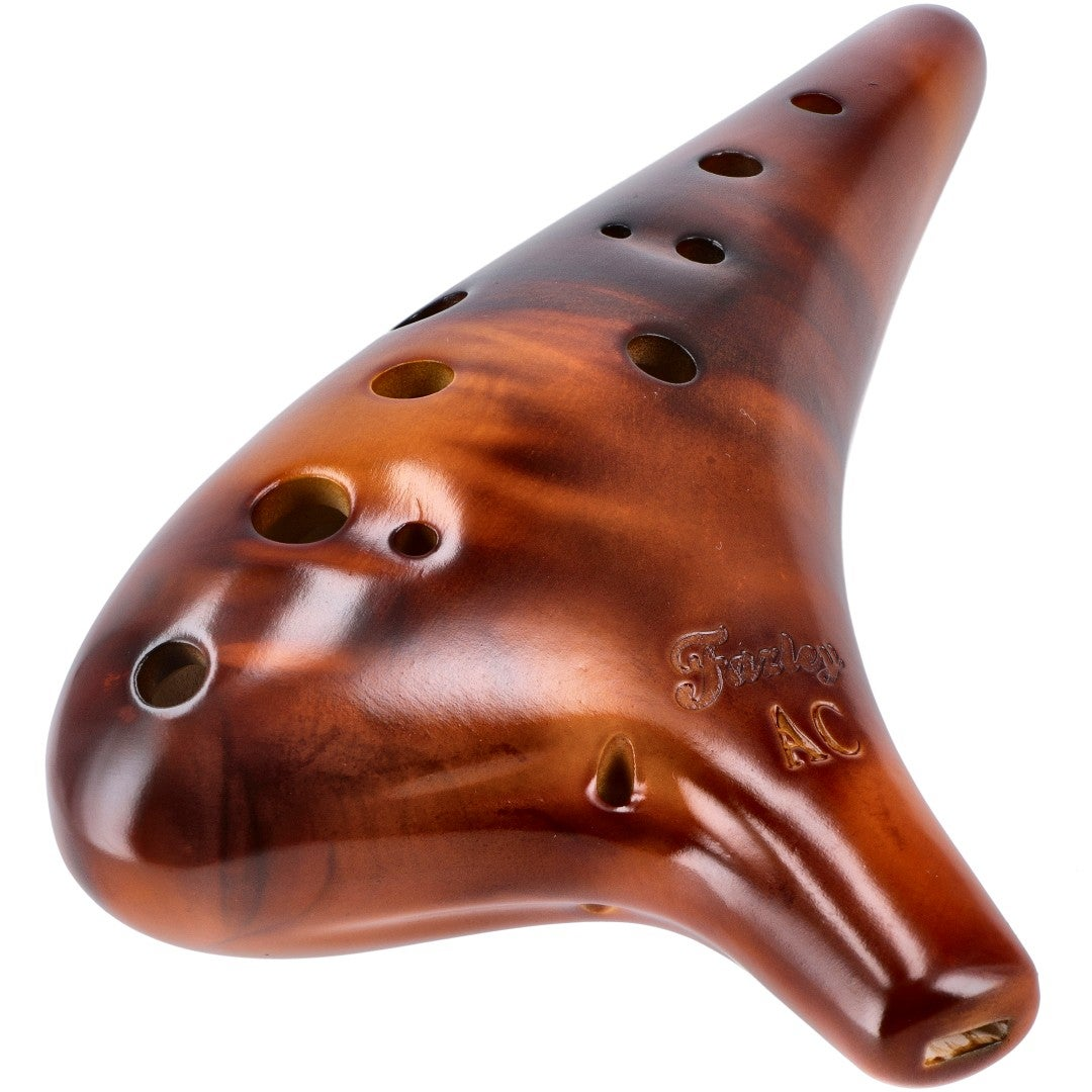 A glossy brown ocarina with 11 holes and a pointed mouthpiece, on a white background.