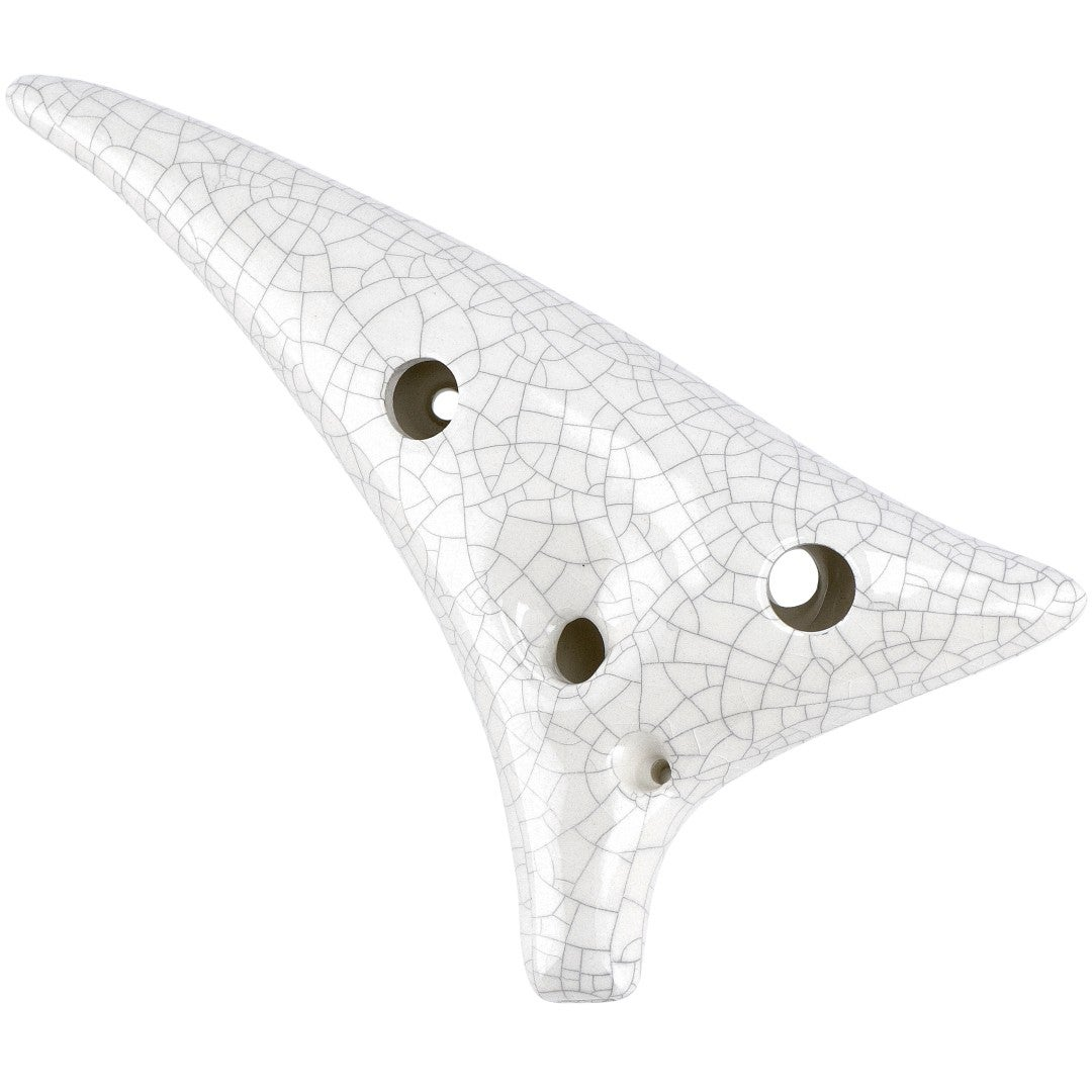 A white ocarina with cracks and holes on a white background.