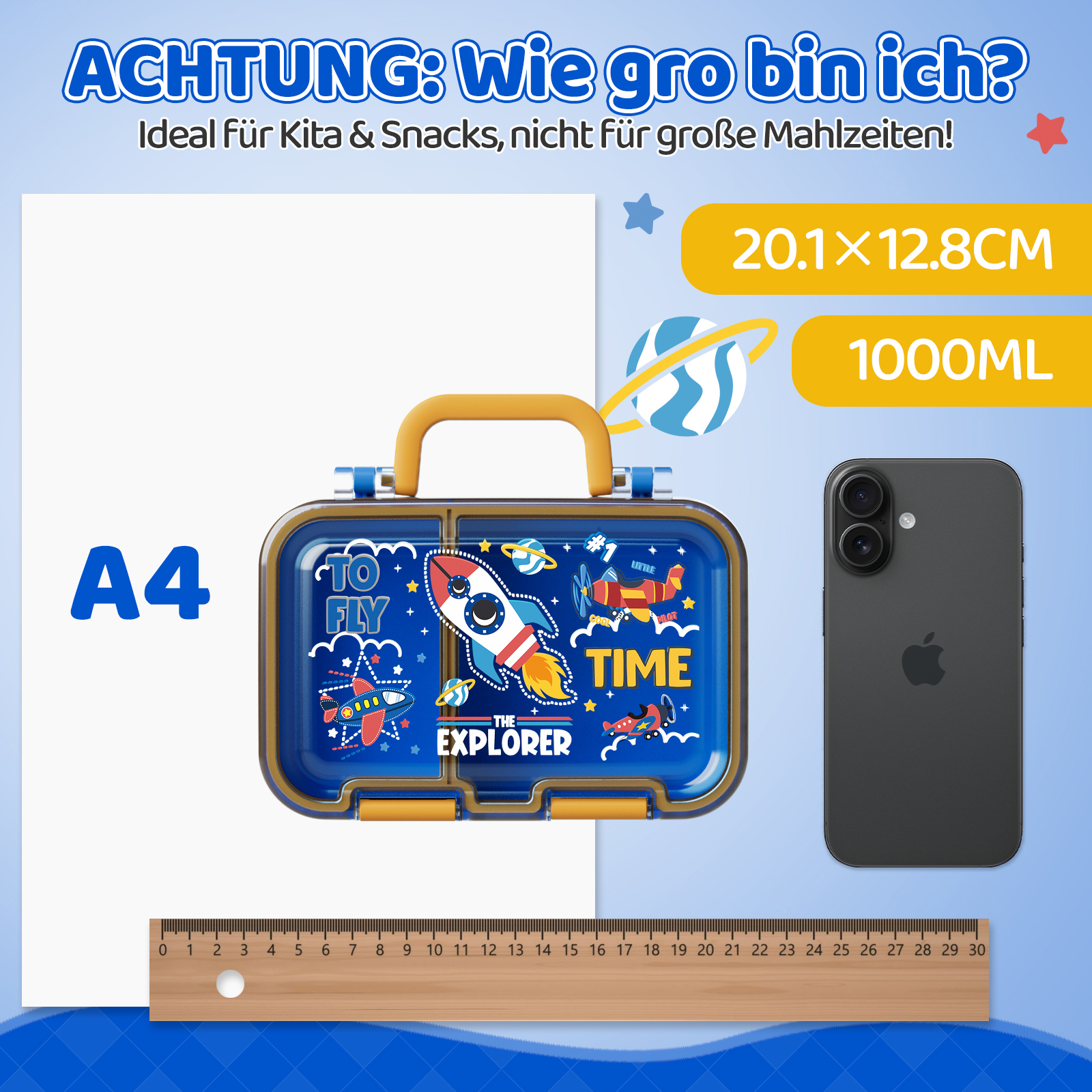 Ein blauer Brotkasten mit Raketenmotiv, A4-Papier, Smartphone und Lineal.