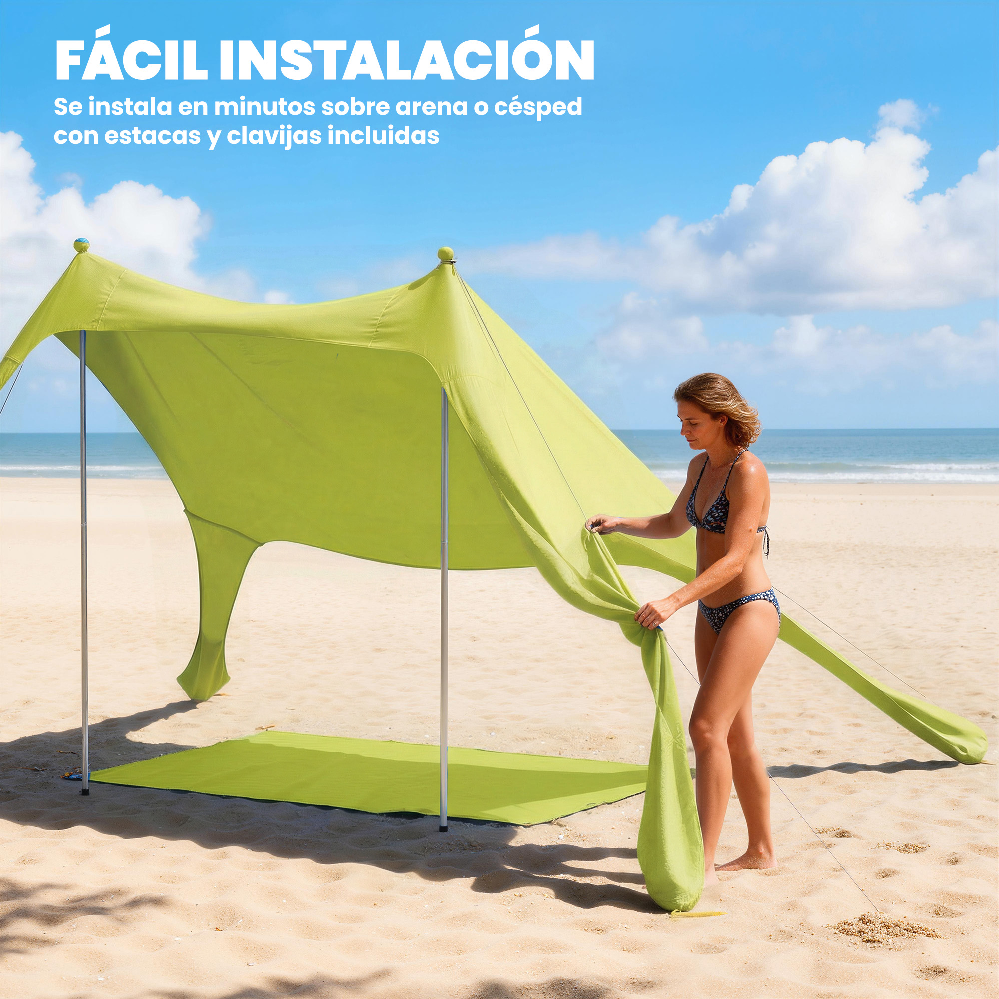 Una mujer monta una carpa de playa verde claro en la playa.