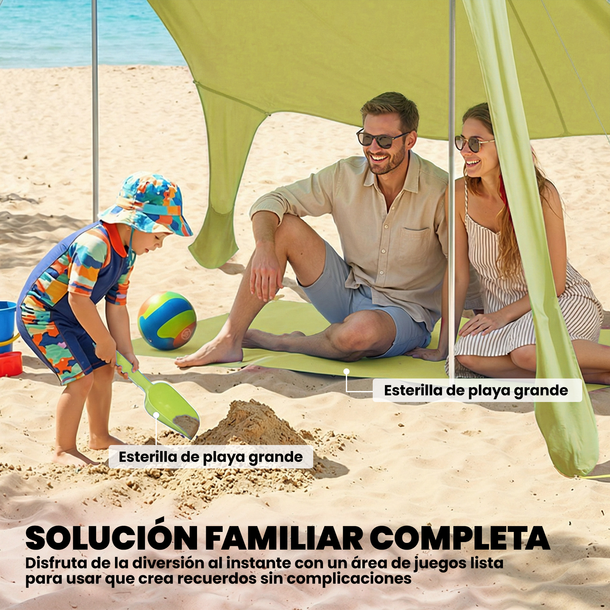 Familia en la playa bajo un refugio, niño juega en la arena.