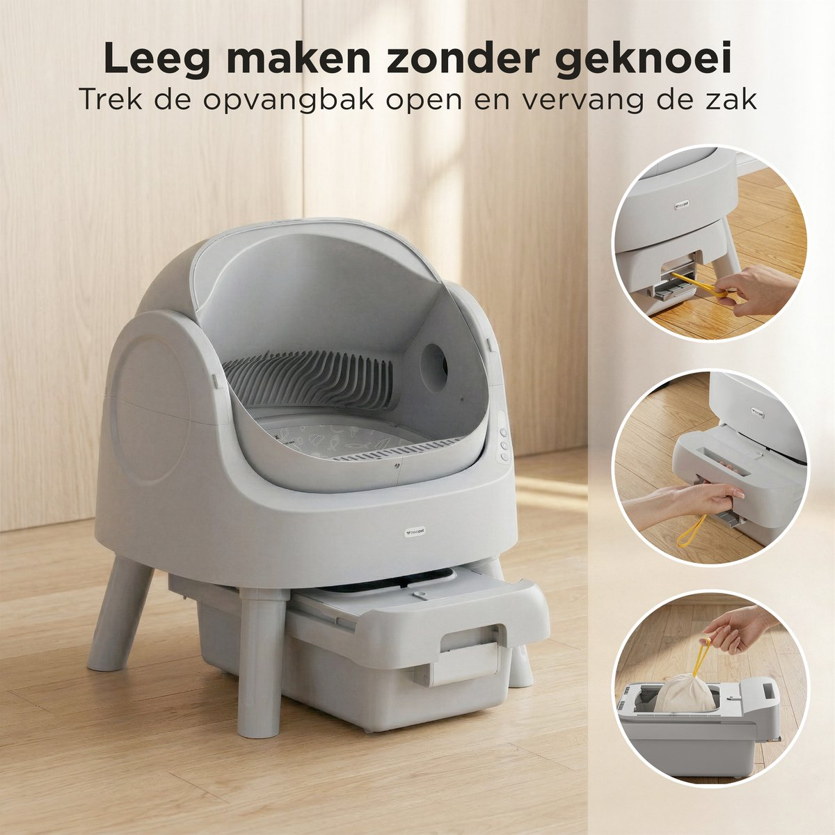 Grijze automatische kattenbak met lade, toont lege zak en handvat.