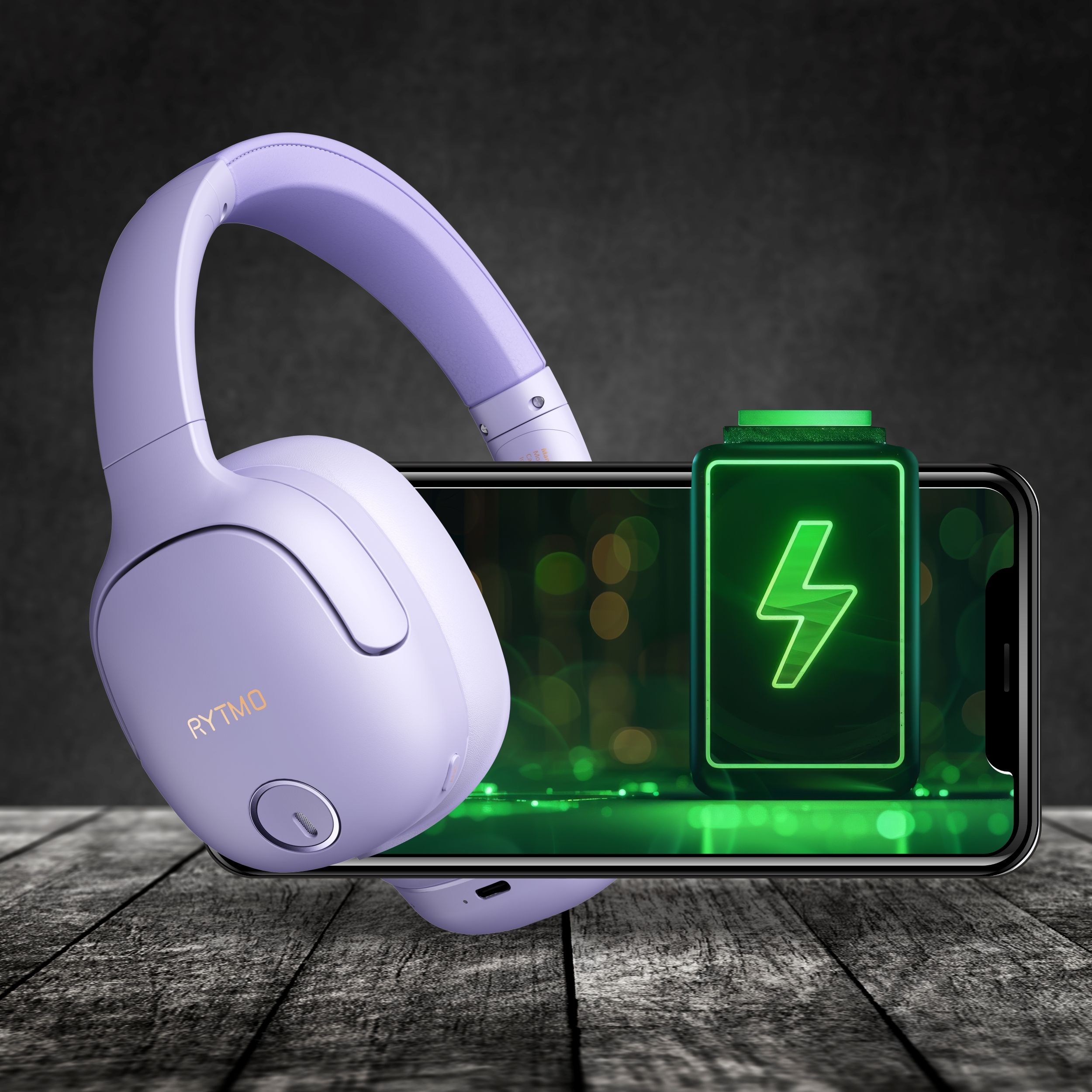 Fioletowe słuchawki na telefonie z ikoną ładowania, na ciemnym tle.