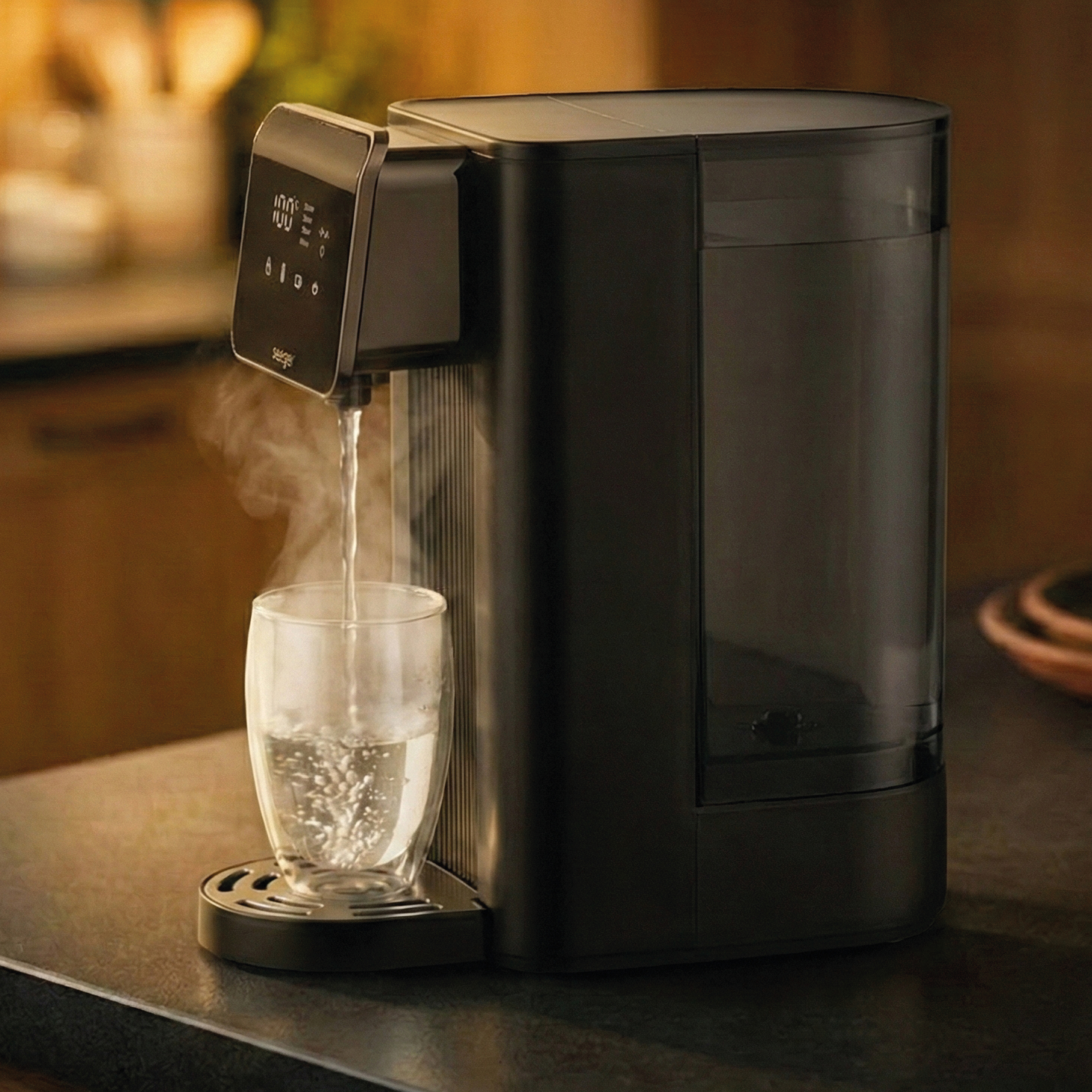 A black water dispenser pours hot water into a glass.