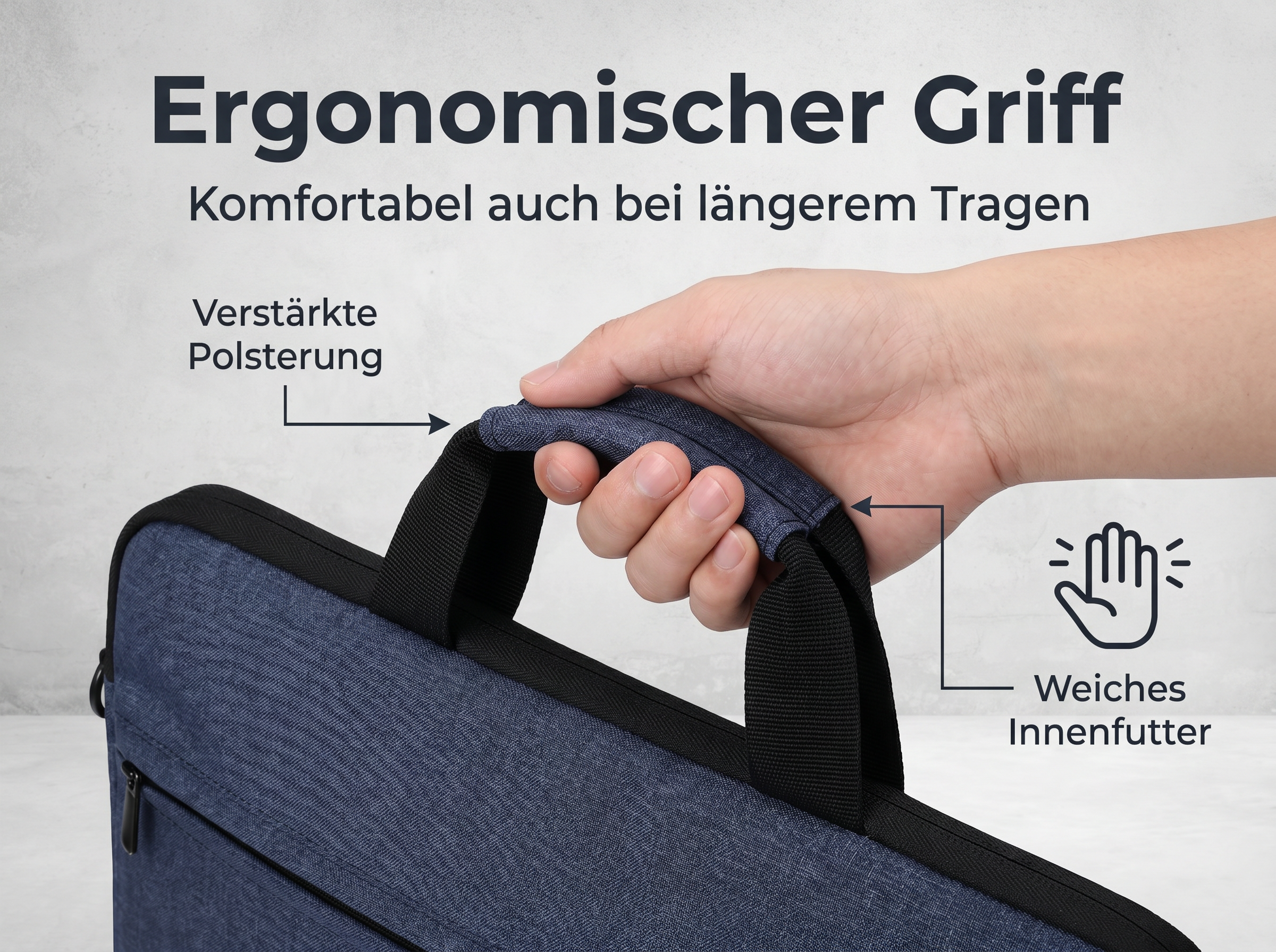 Eine Hand hält den gepolsterten Griff einer blauen Tasche.