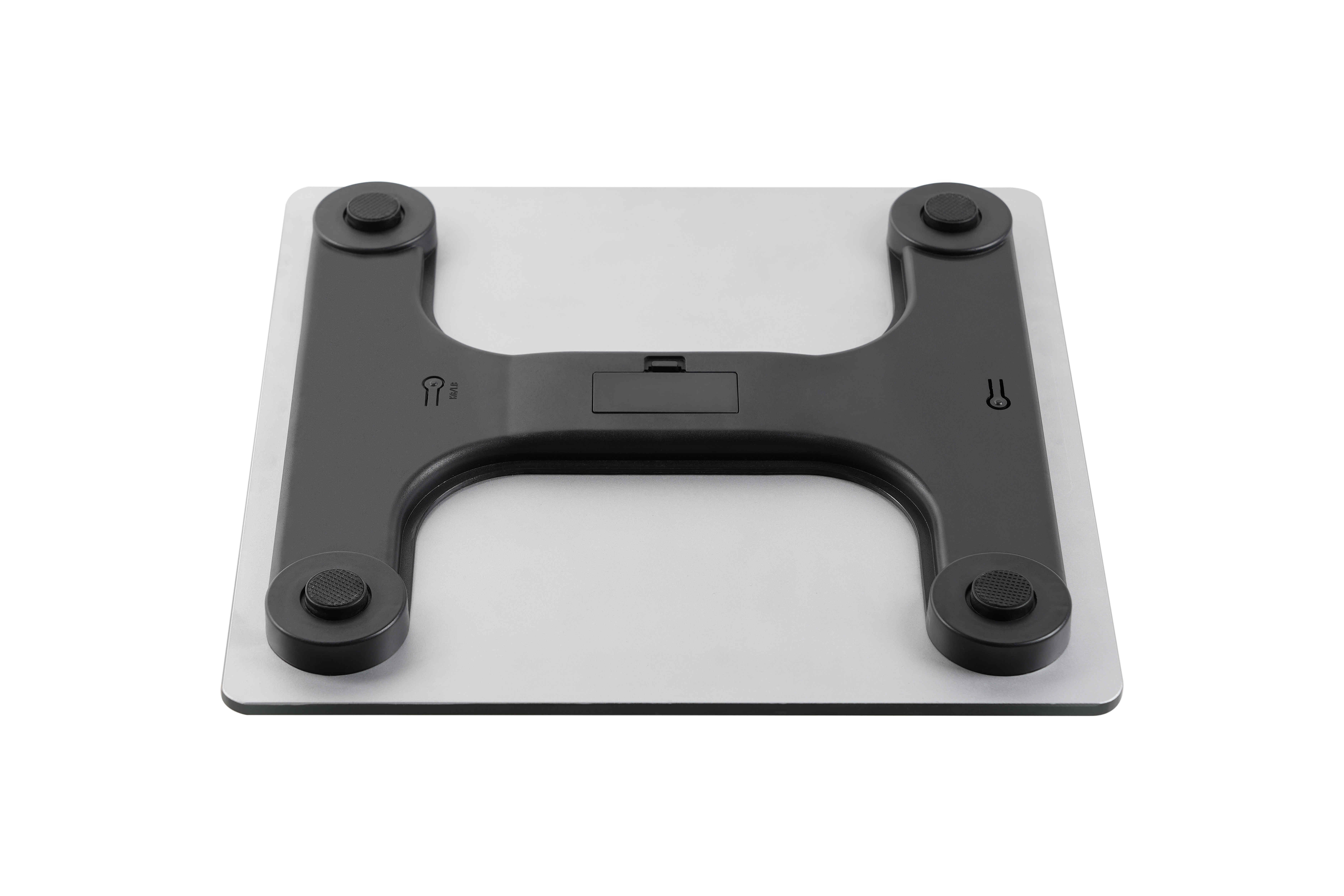 A digital scale with a silver platform and a black H-shaped frame. Isolated.