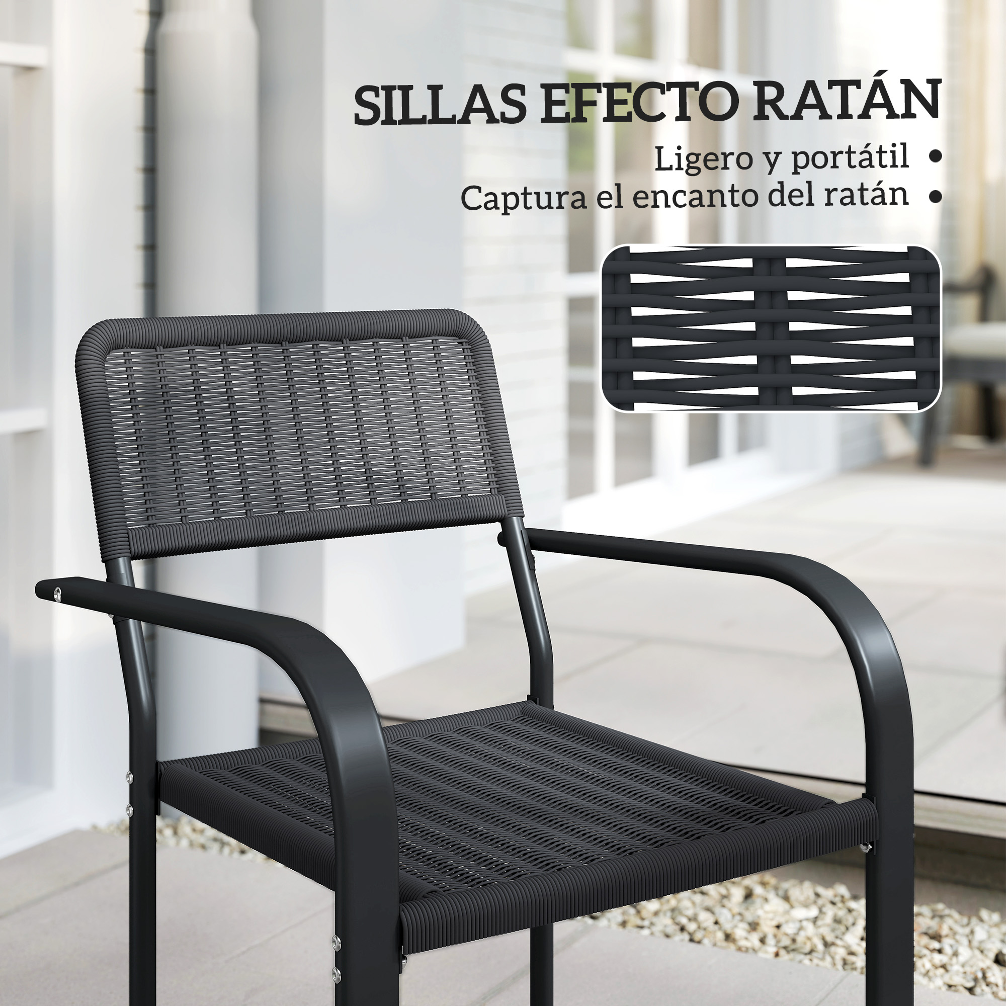 Una silla negra efecto ratán con marco de metal está en un patio.