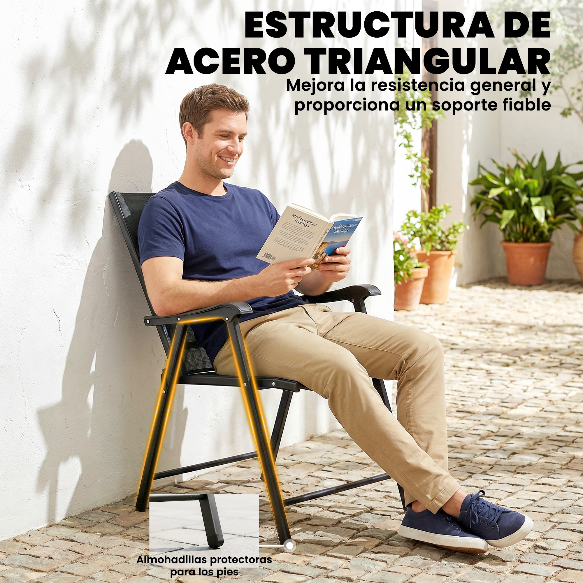 Un hombre sentado al aire libre lee un libro. La silla tiene estructura metálica y protectores.