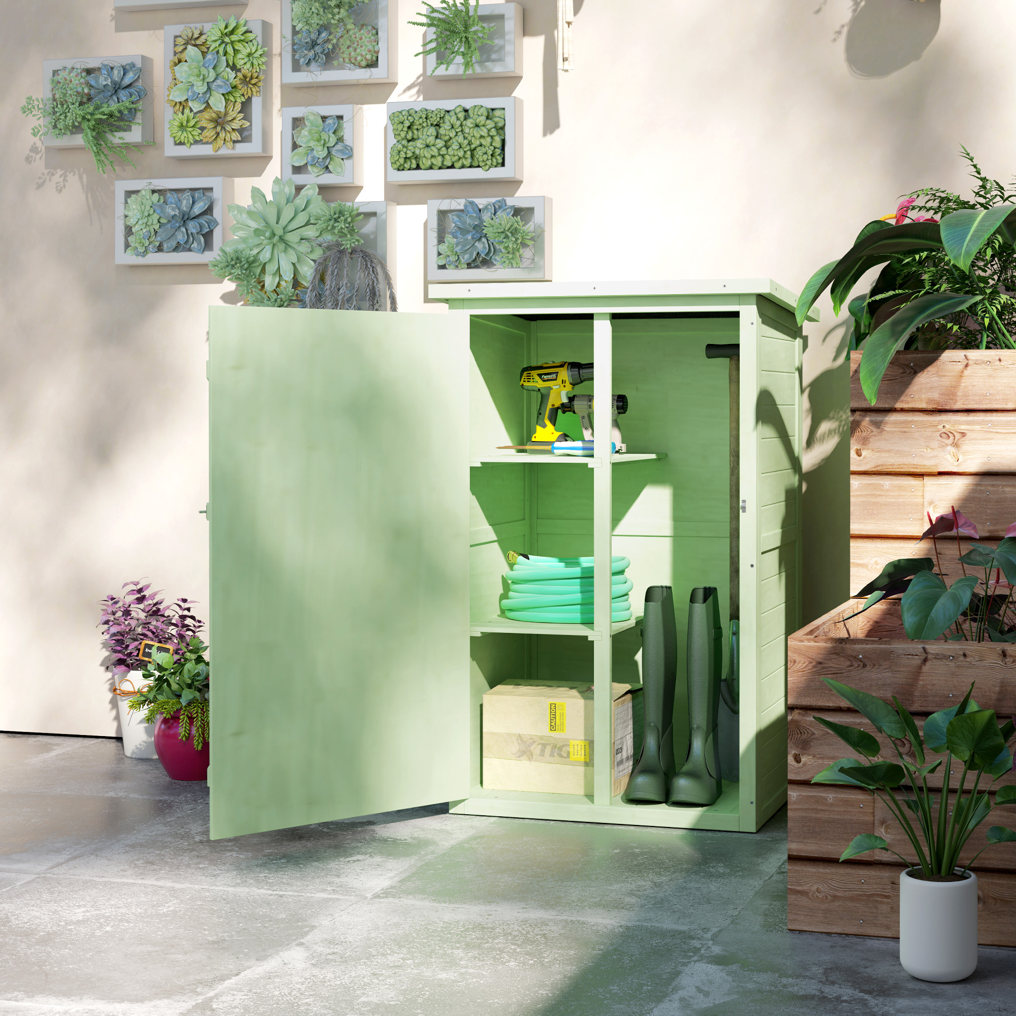 Un armario de almacenamiento verde claro con puertas abiertas, con herramientas y artículos de jardín.