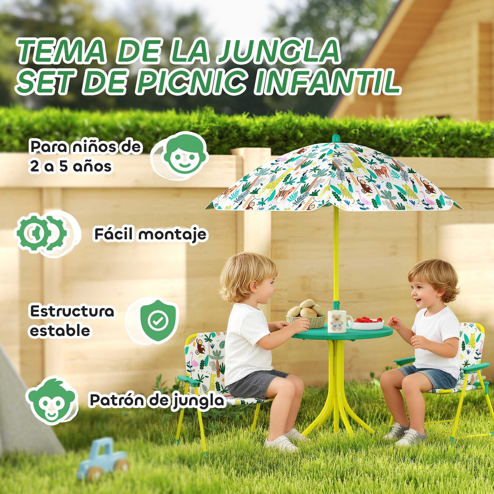 Dos niños sentados en una mesa y sillas de picnic de temática selvática bajo un paraguas.