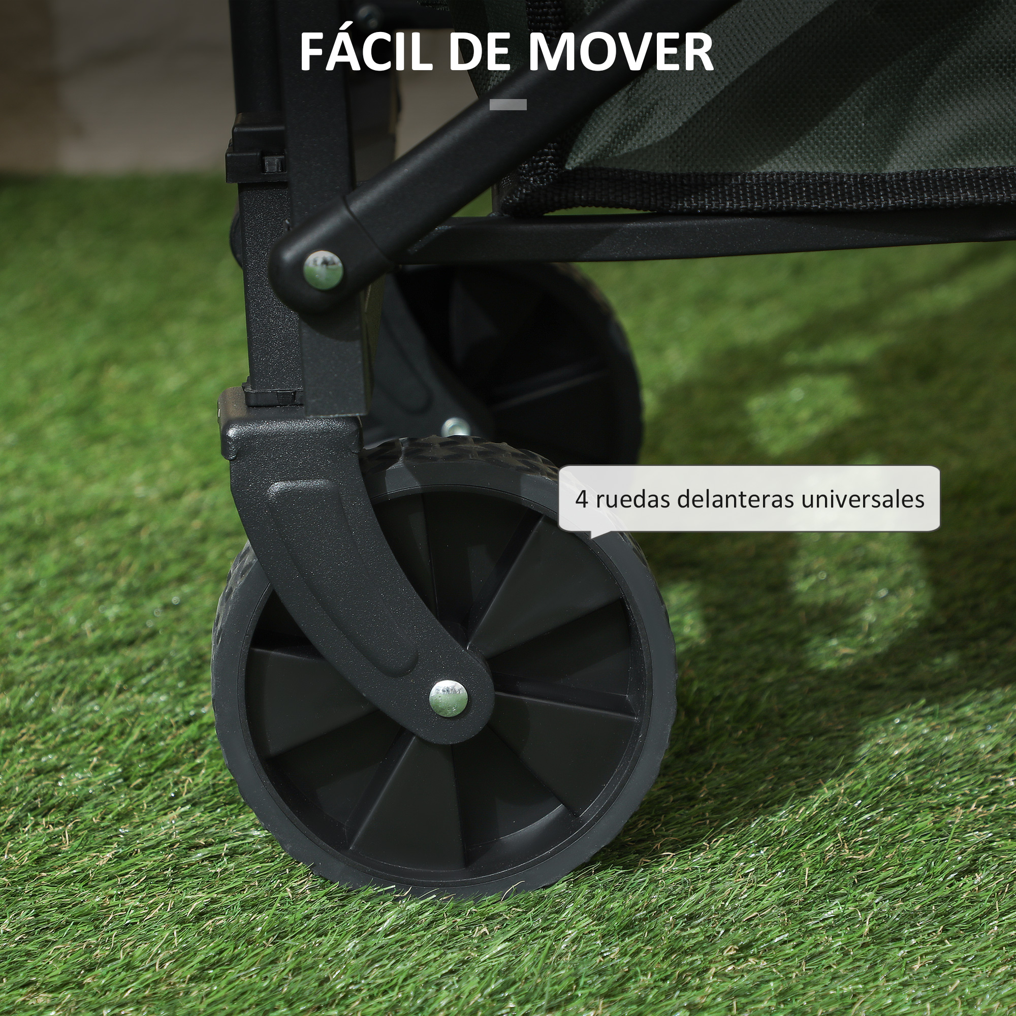 Primer plano de las ruedas negras de un carro sobre césped artificial verde.