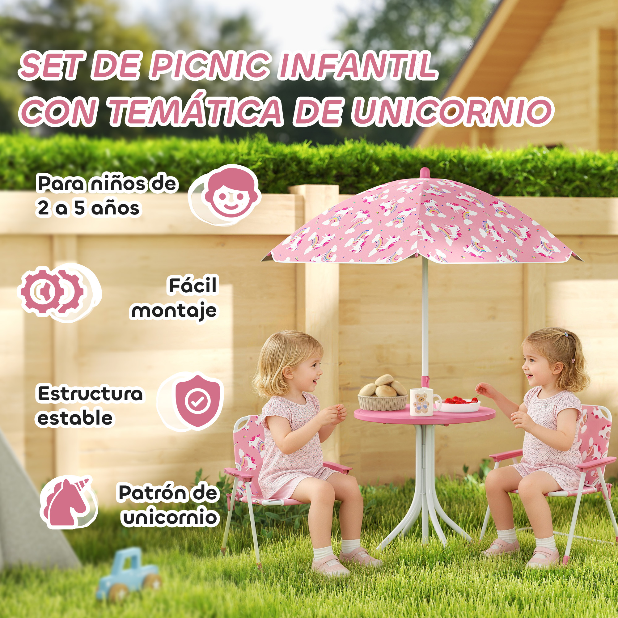 Dos niñas sentadas en una mesa rosa con sombrilla de unicornio al aire libre.