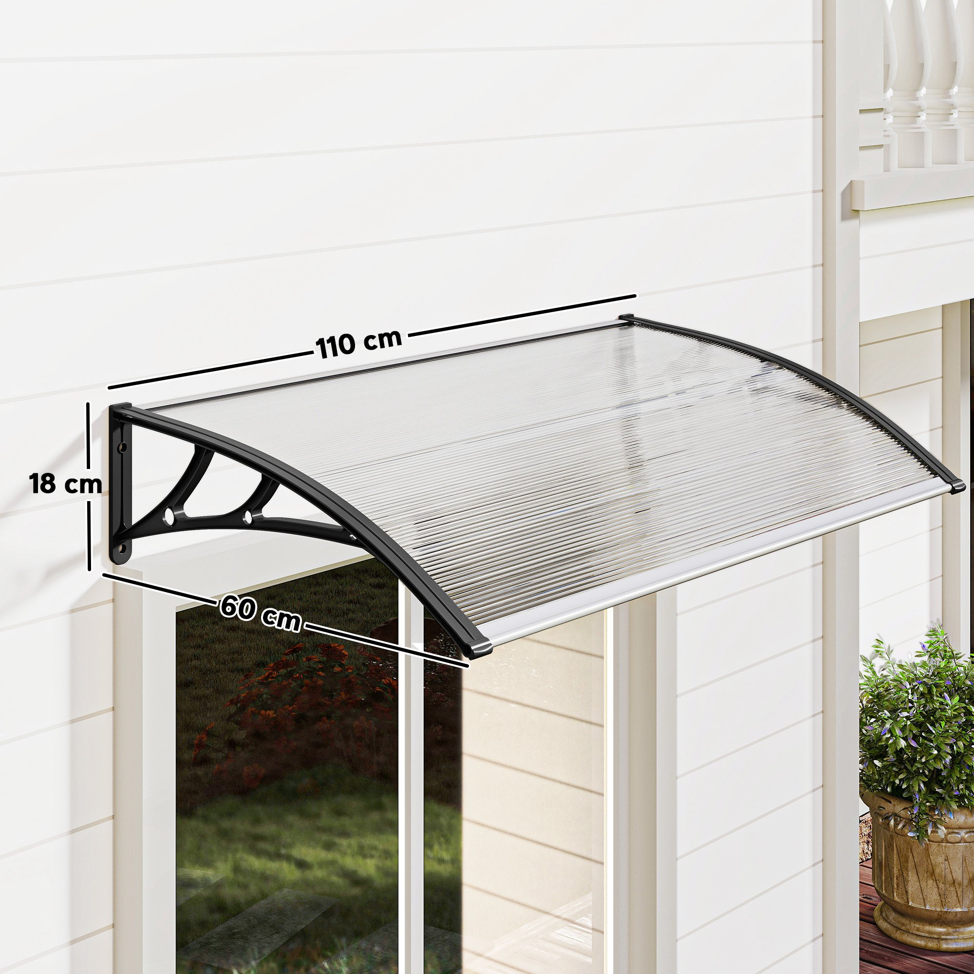 Un toldo transparente con soportes negros sobre una ventana.