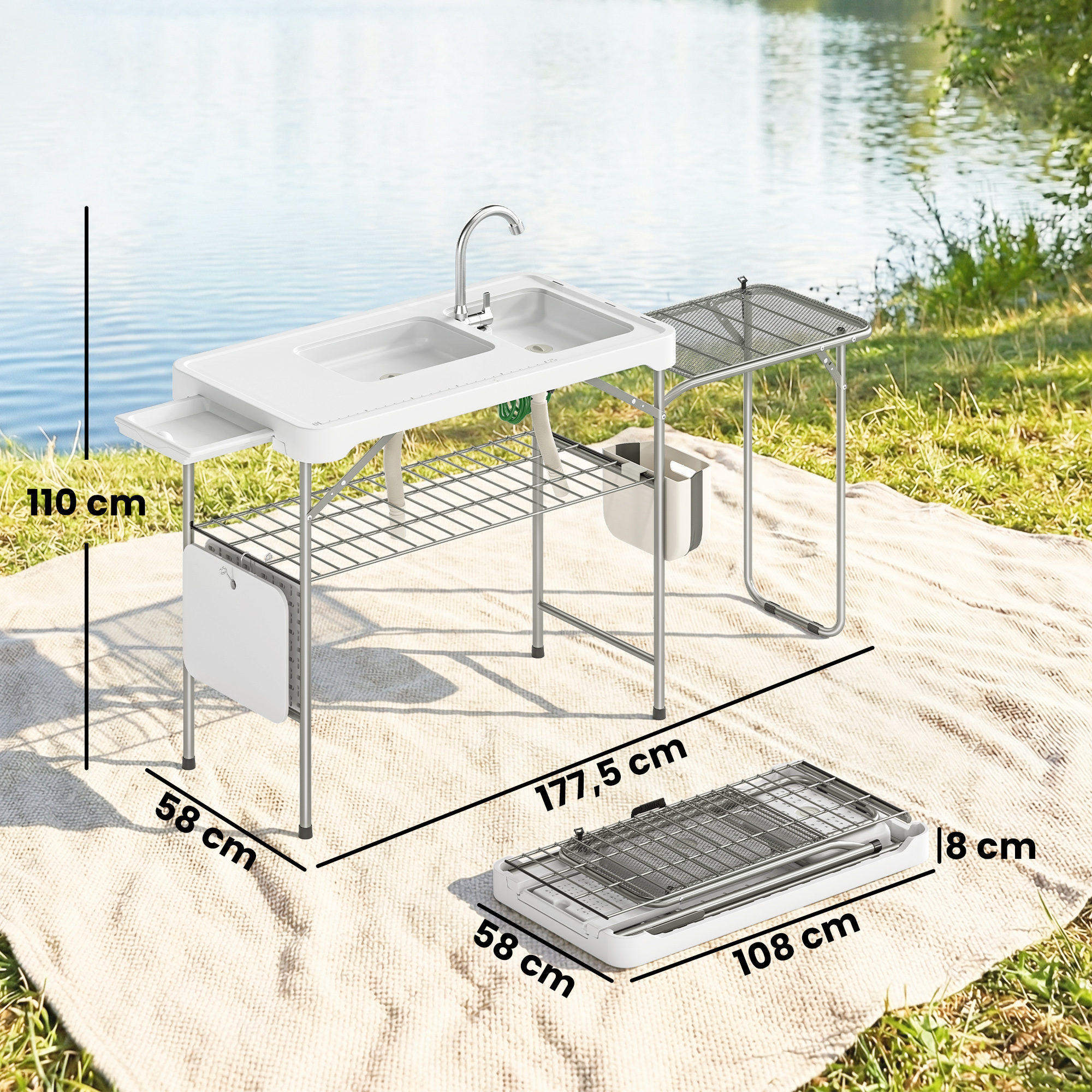 Un fregadero blanco de camping con grifo y escurridor está montado al aire libre.