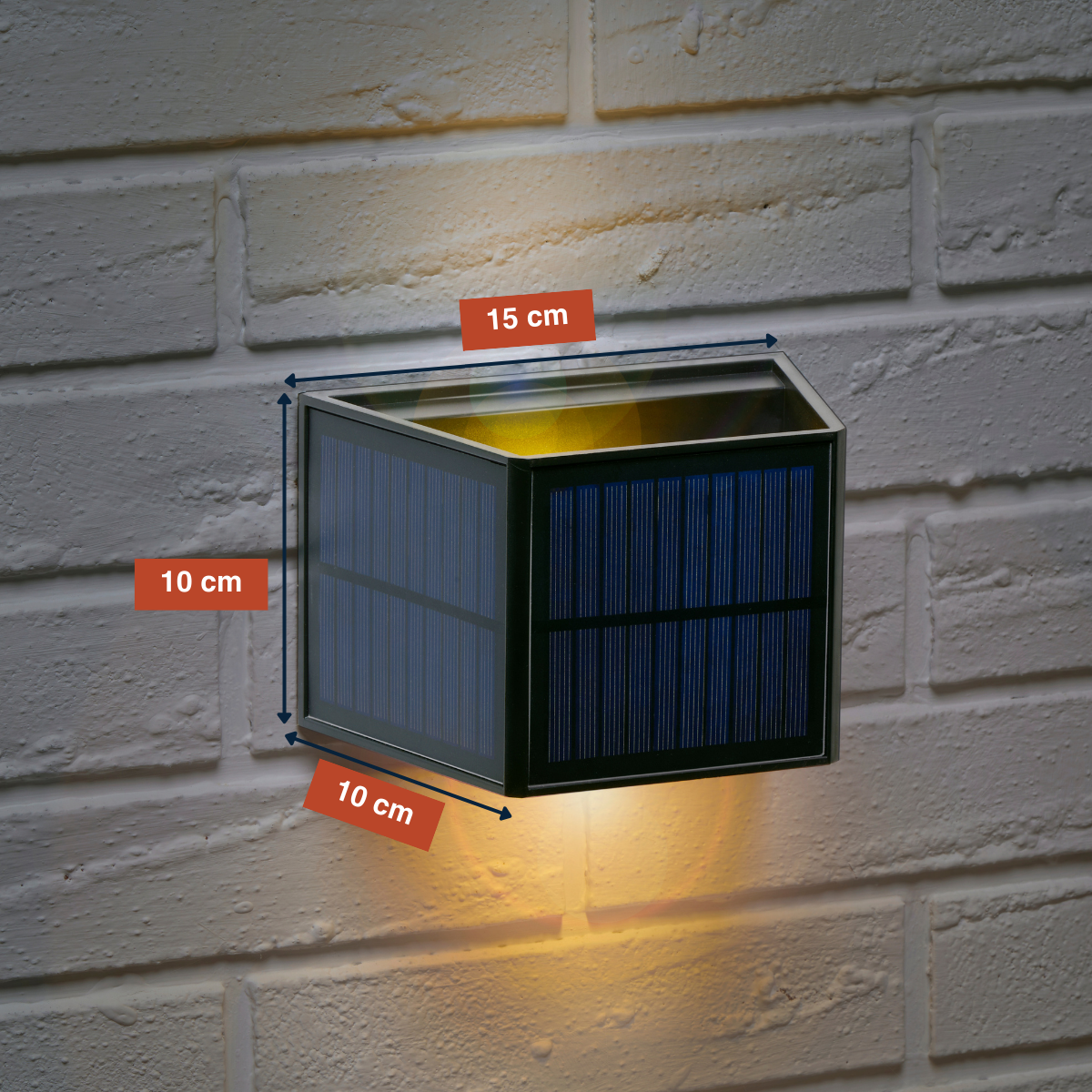 A solar-powered wall light with dimensions shown on a brick wall.