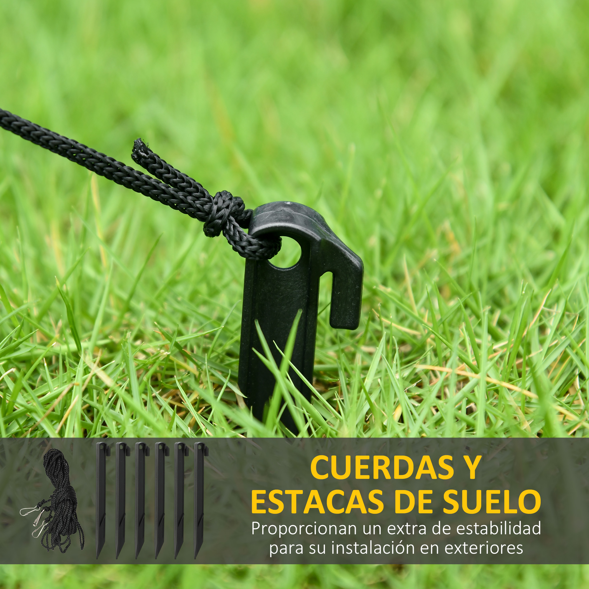 Cuerda negra y estacas en el césped, accesorios para exteriores.
