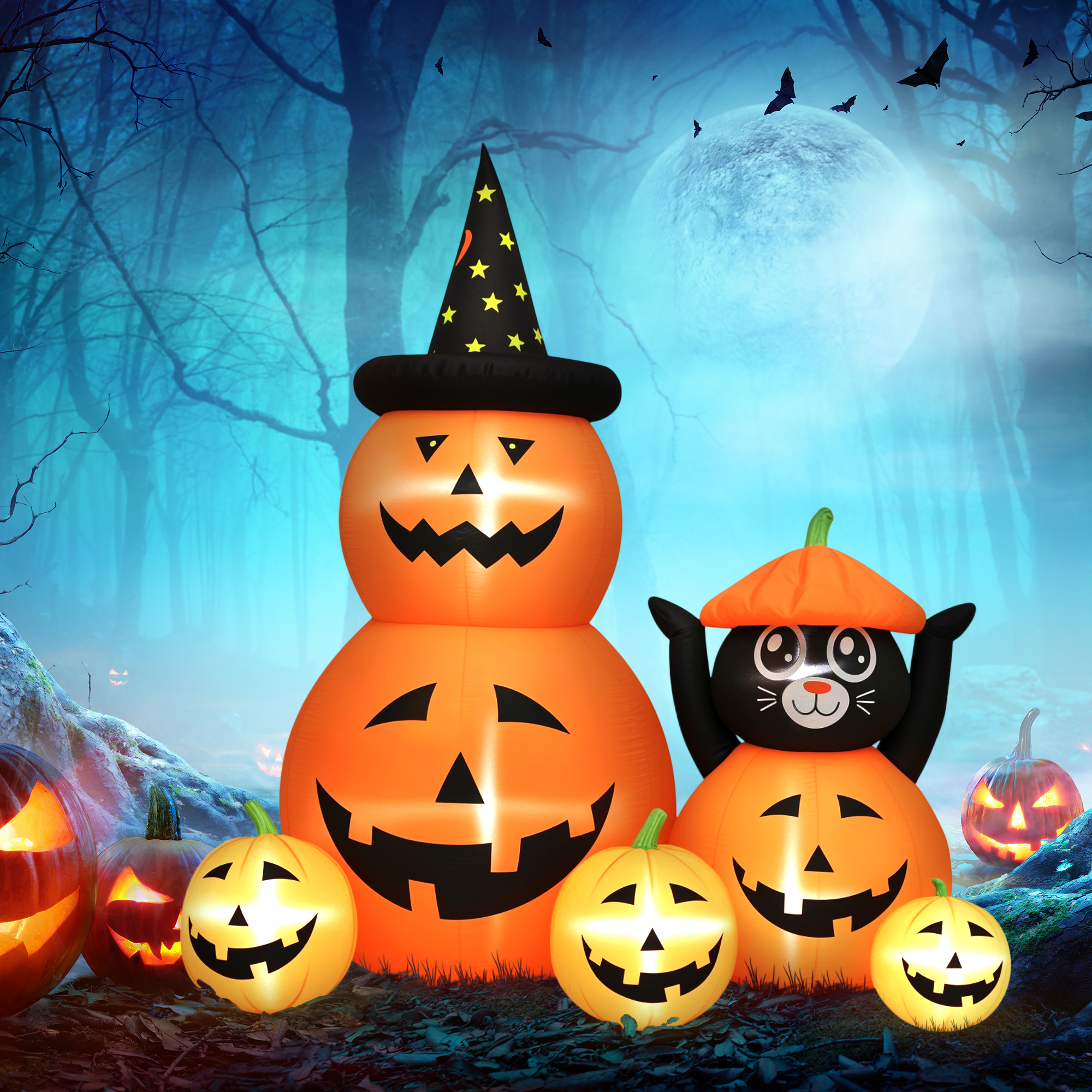 Decoraciones inflables de Halloween en un bosque con luna y murciélagos.