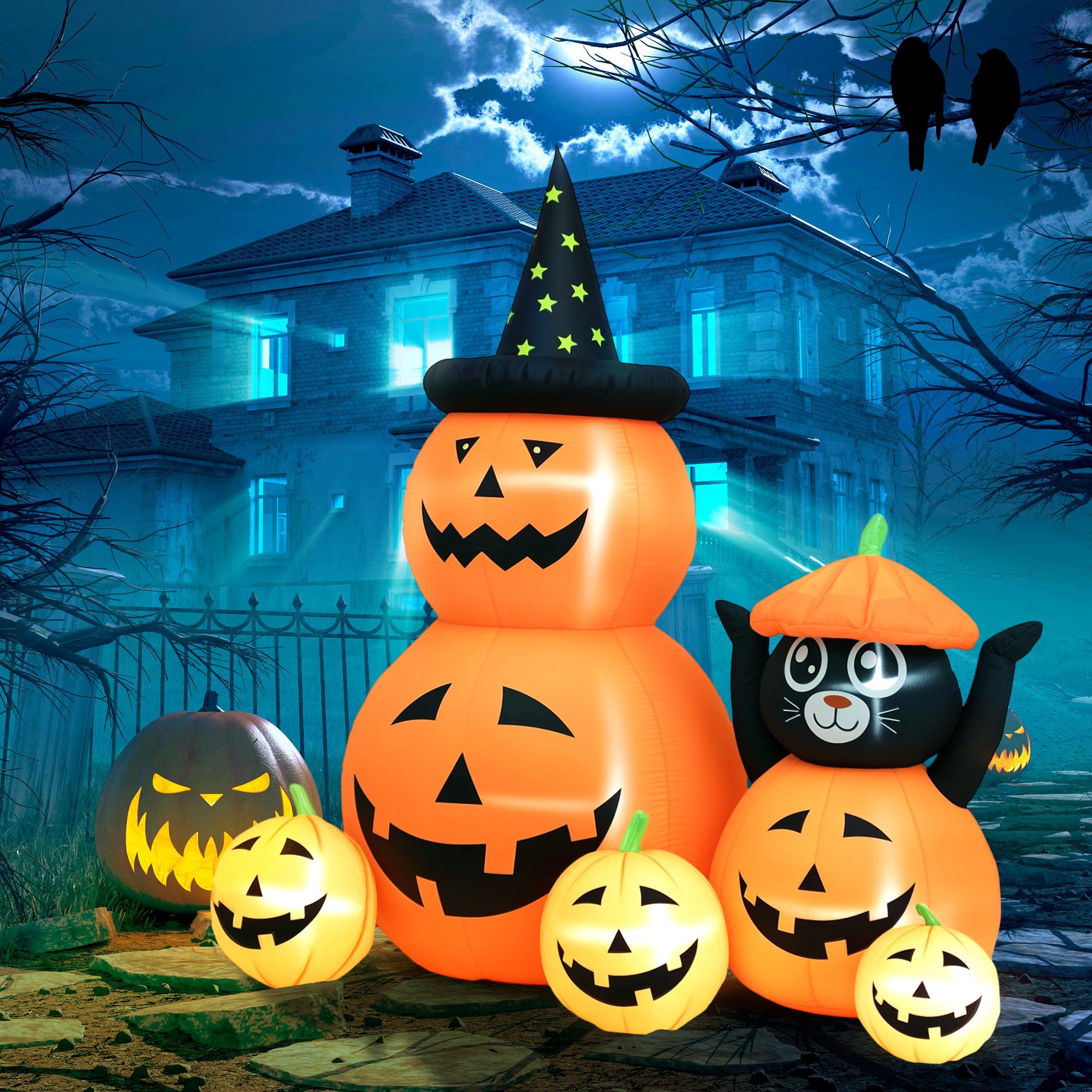 Decoraciones inflables de Halloween: calabazas, gato y casa de noche.