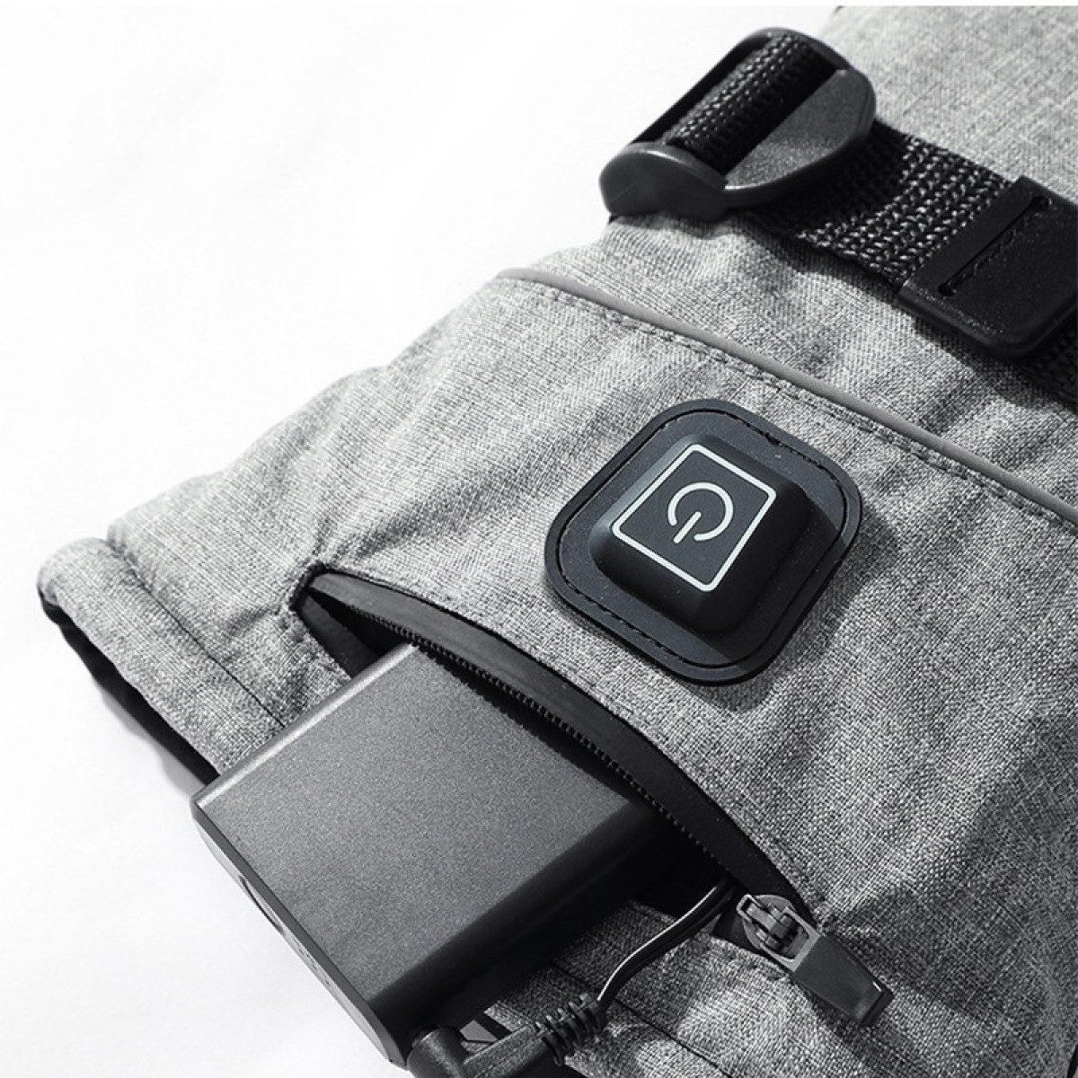 Guanto riscaldato grigio con power bank e icona di accensione.