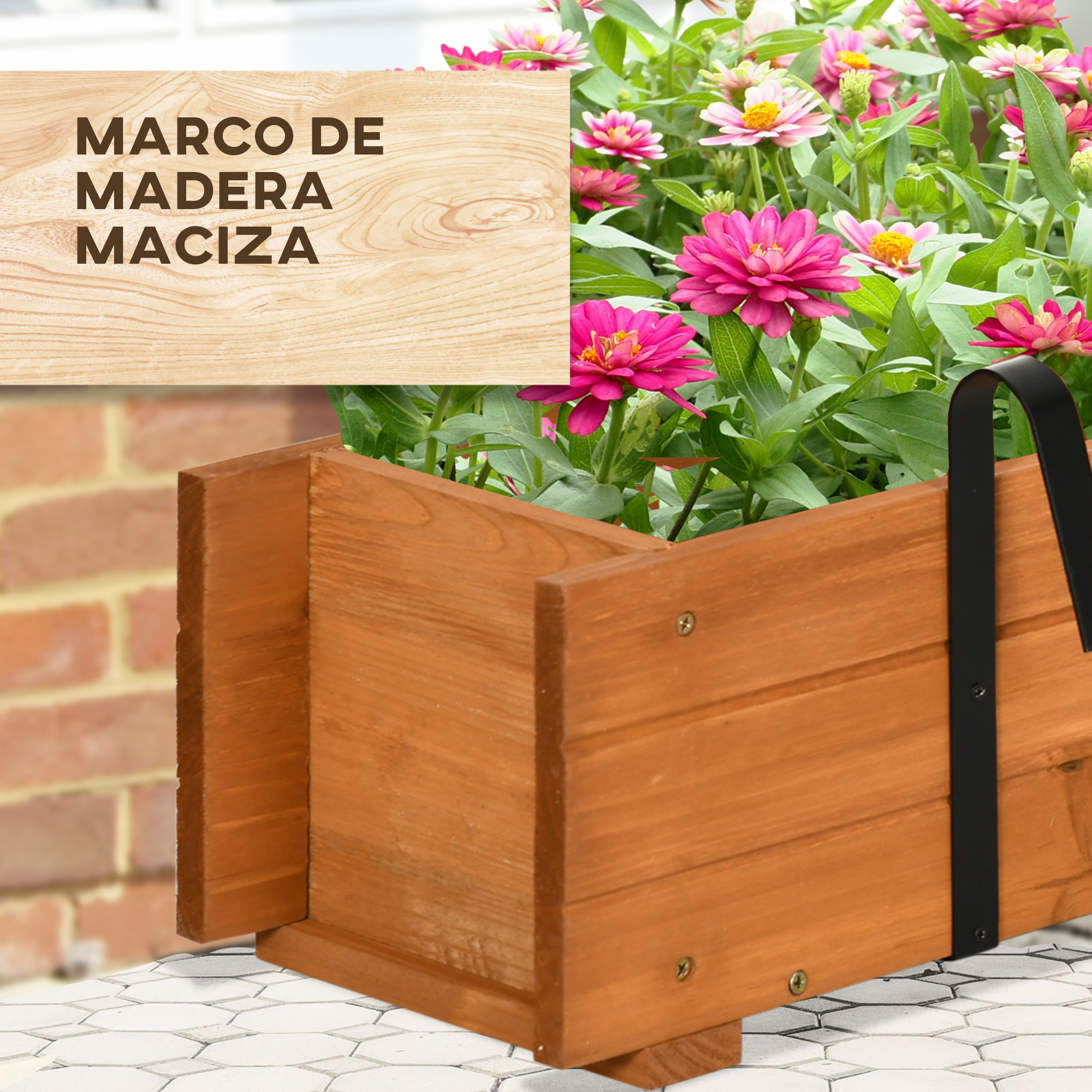 Macetero de madera con zinnias rosas y blancas, pared de ladrillos al fondo.