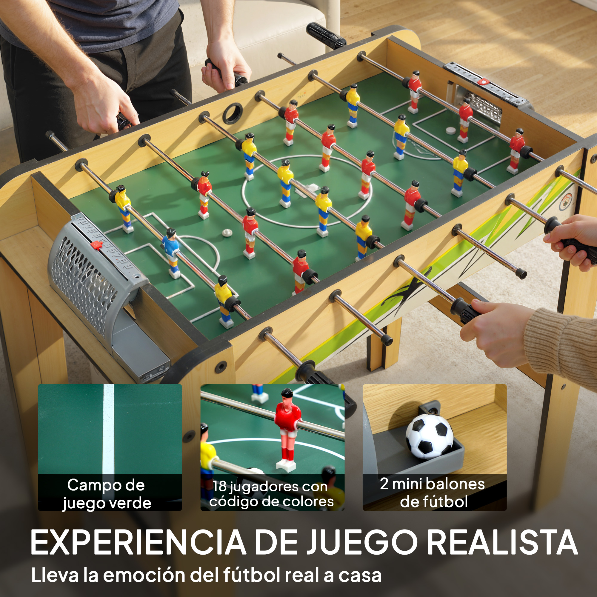 Mesa de futbolín con jugadores rojos y amarillos. Manos agarrando las asas.