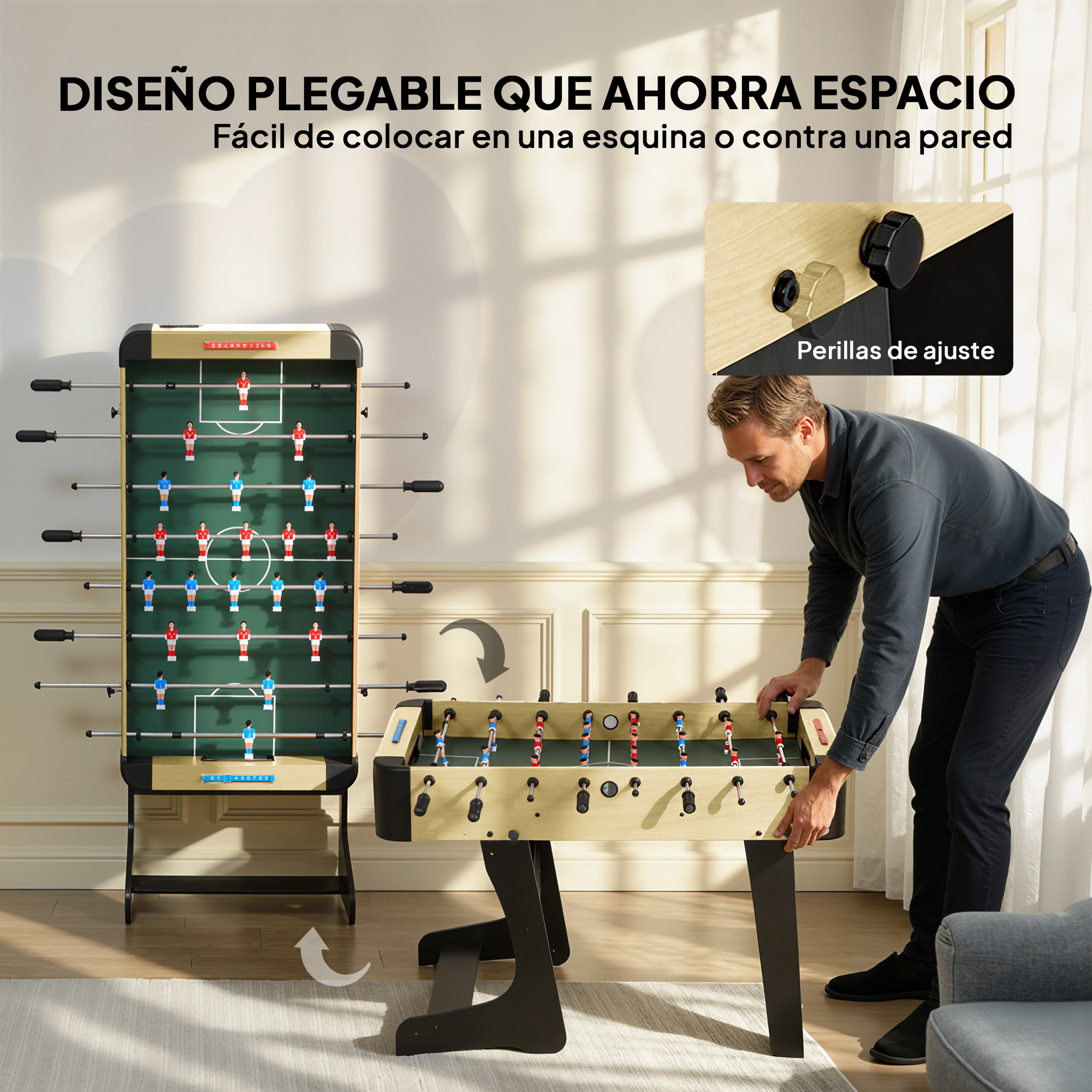 Un hombre monta un futbolín plegable. Un segundo futbolín está a su lado.