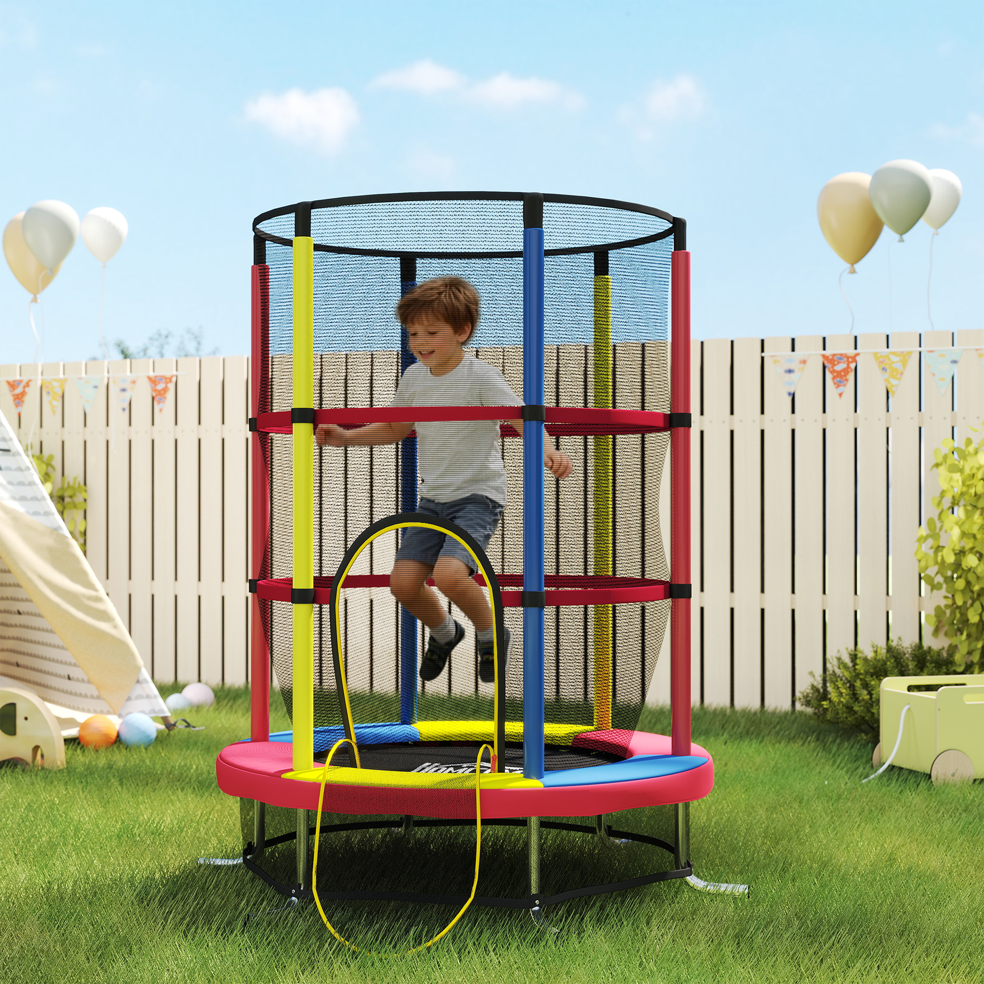 Un niño salta en un trampolín colorido en un patio trasero. Se ven globos y banderines.