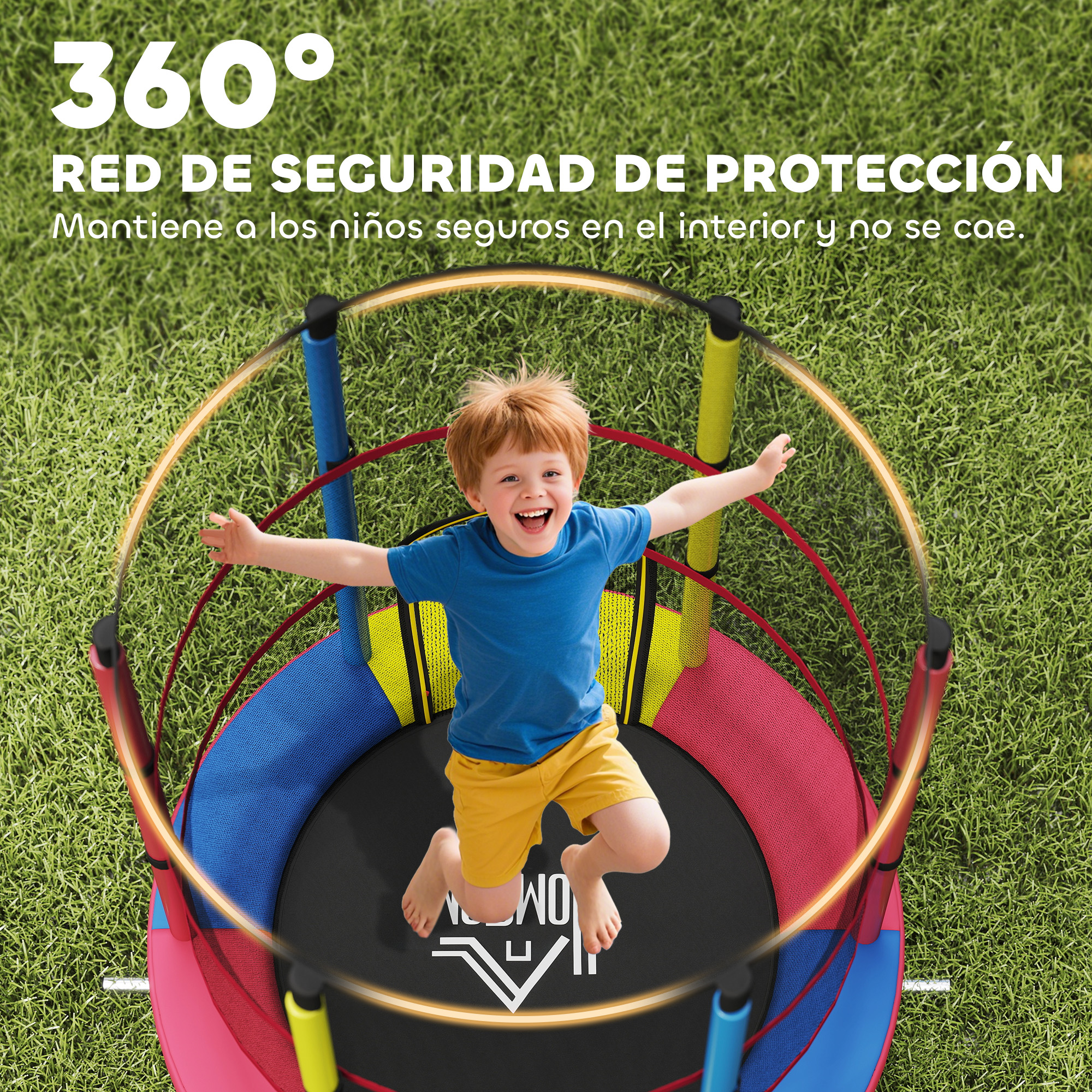 Un niño salta en un trampolín colorido con red, sobre césped.
