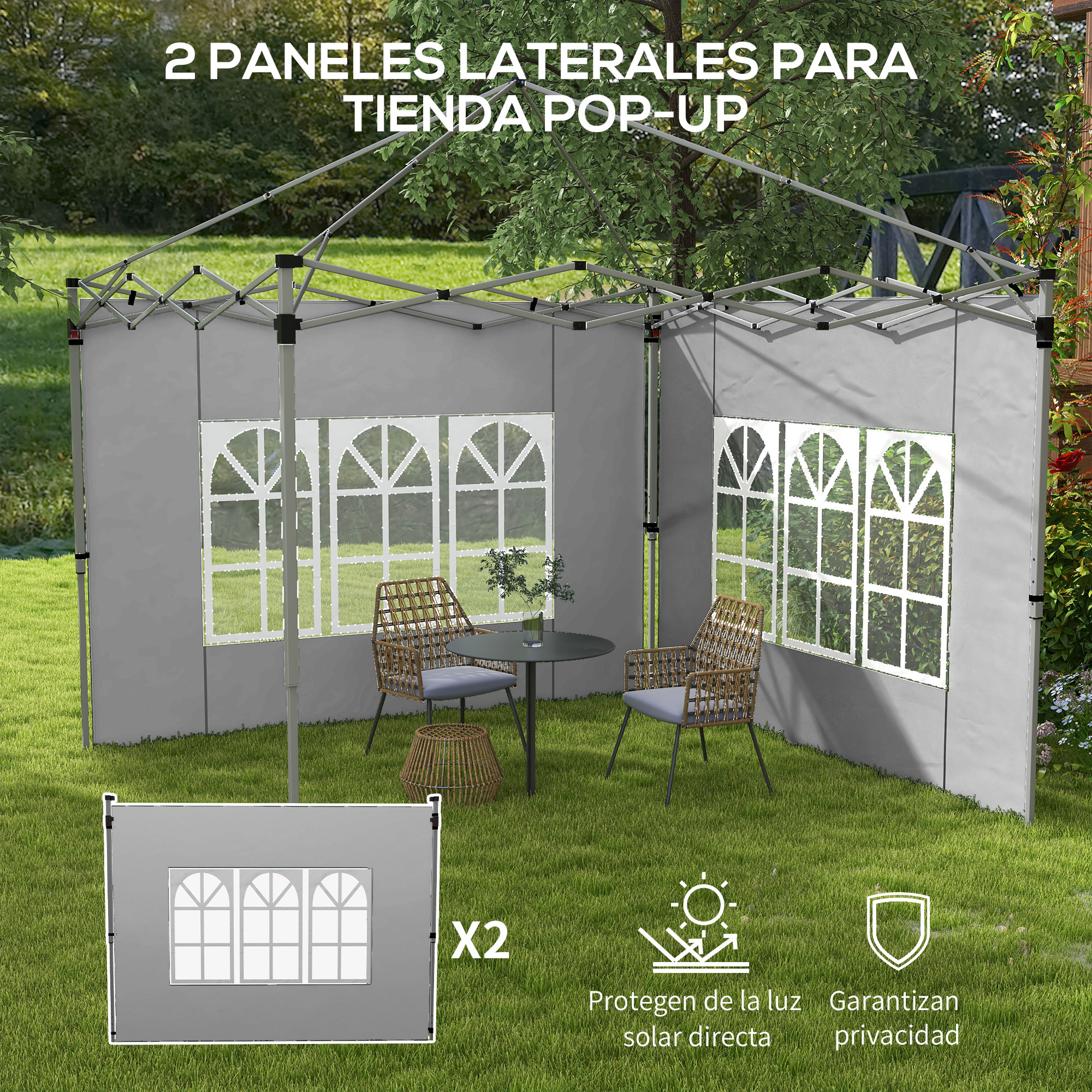 Tienda pop-up gris con ventanas, mesa y sillas en un jardín.