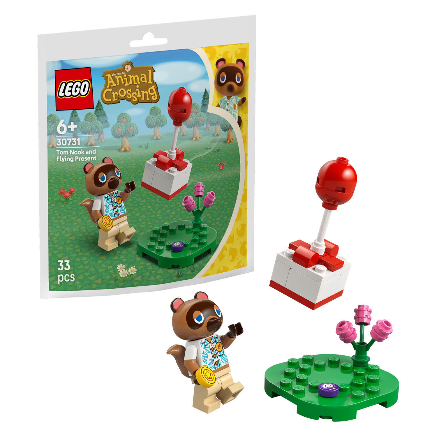 Tom Nook figürlü LEGO Animal Crossing seti, uçan hediye ve çiçekli sergileme alanı.