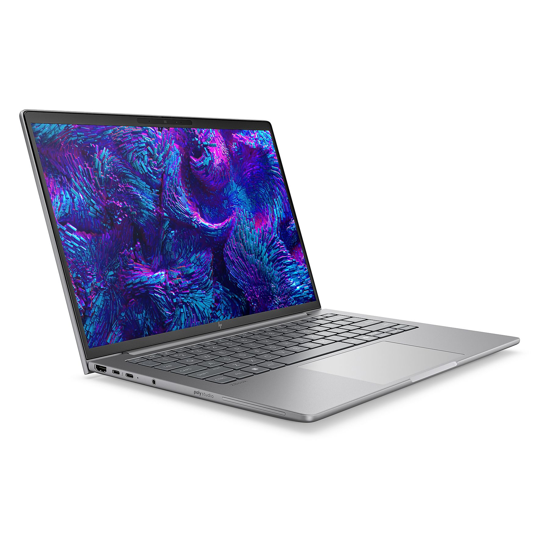 Un laptop argentato è aperto. Lo schermo mostra un motivo astratto blu e viola.
