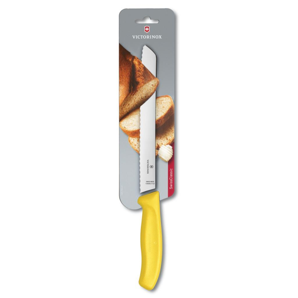 Sarı saplı Victorinox ekmek bıçağı, tırtıklı bıçak, ekmek dilimleri ile paketlenmiş.