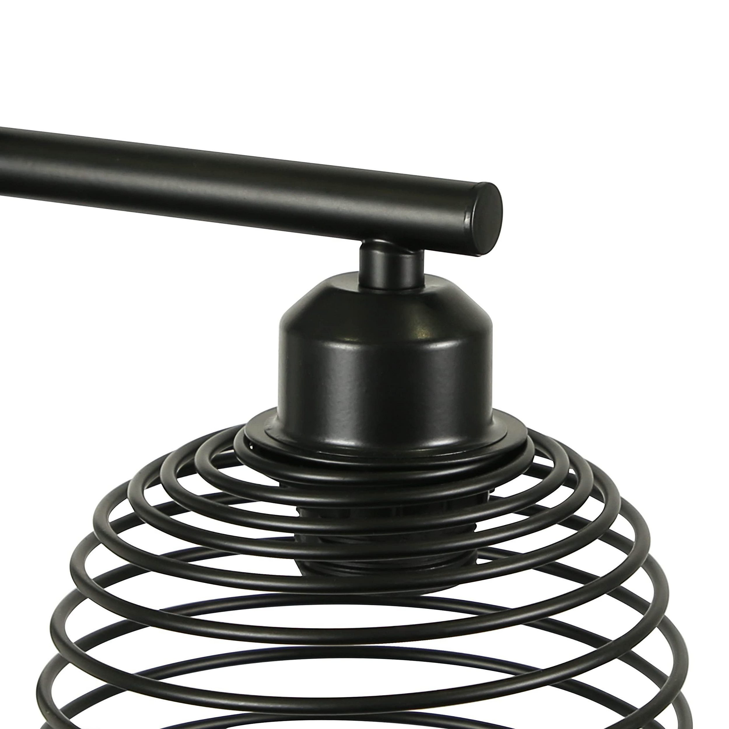 Un paralume nero in metallo con design a filo a spirale su sfondo bianco.